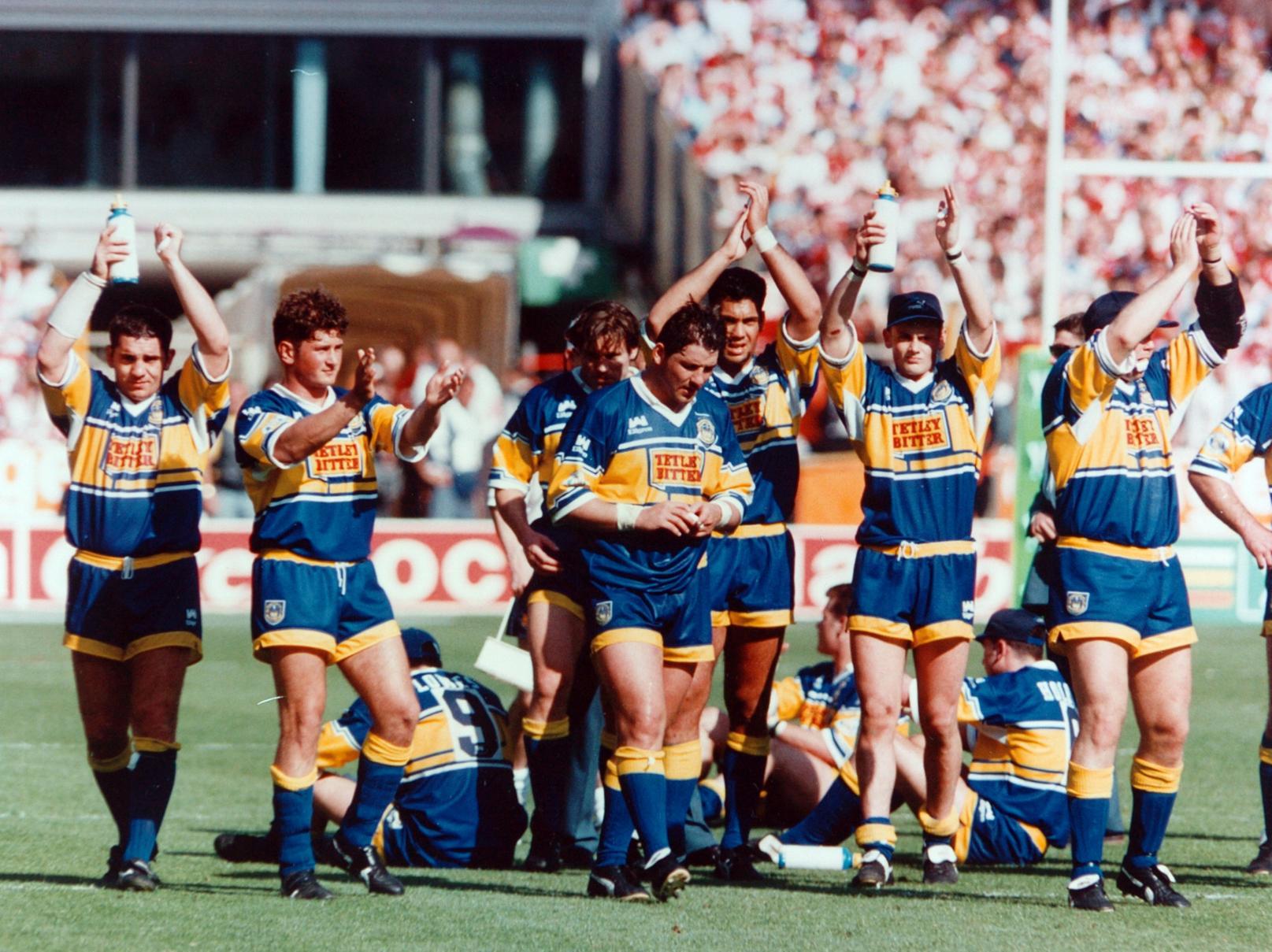 A disappointed Leeds RL team applaud their fans after defeat in the Silk Cut Challenge Cup against Wigan.