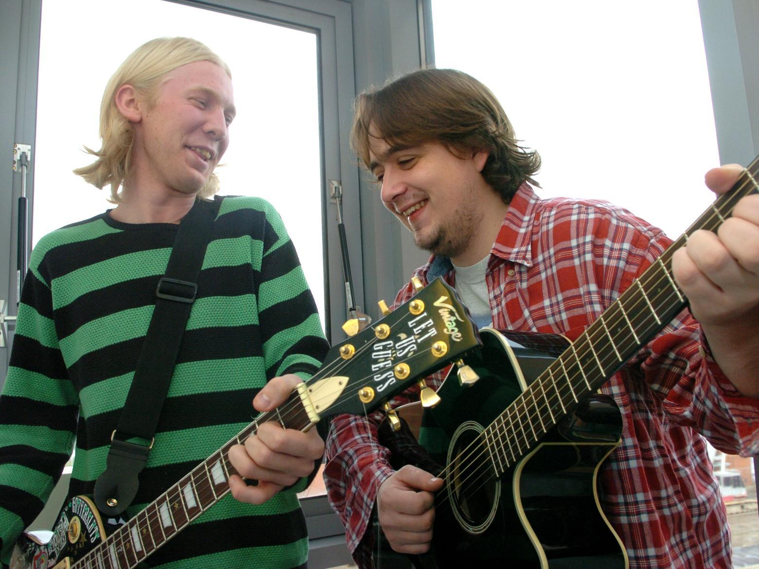Guitar players from Leeds, Rob Galloway, left, and Stephen Cavadino, who raised money for Half and Half.