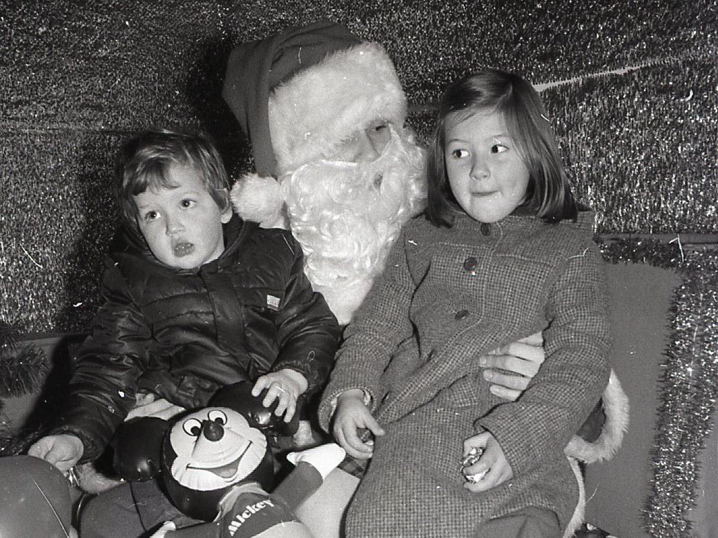 Pictured above - a pair of children enjoy a visit with Father Christmas at Lewis's in Blackpool