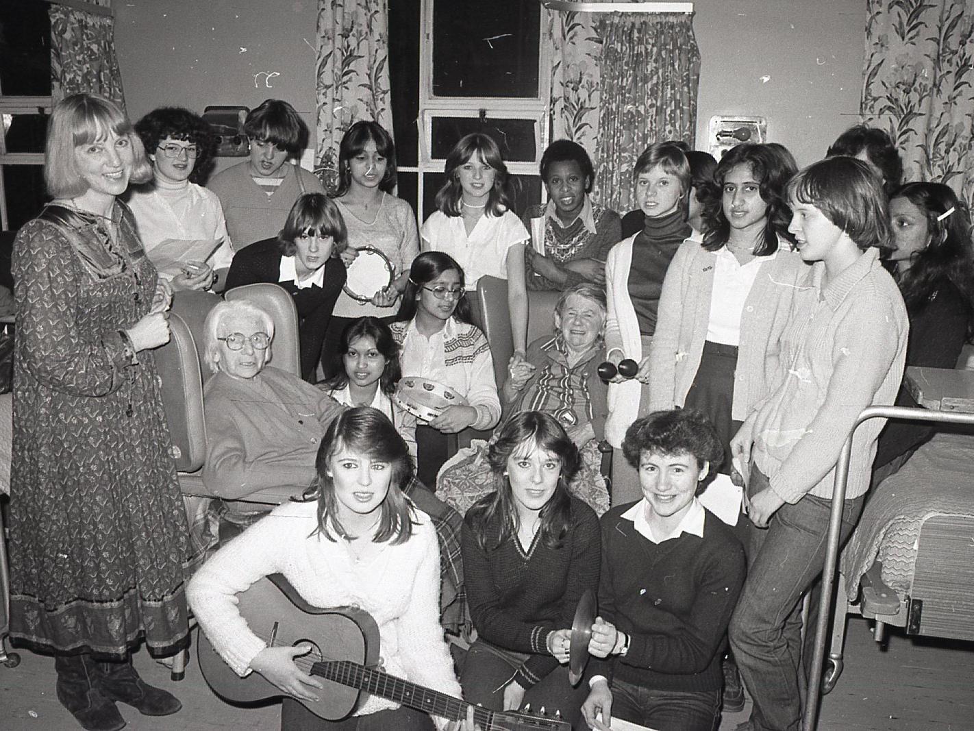 Students from Preston's Tuson College's Winckley Square annexe were in good voice when they brought a little happiness to these patients at the town's Mount Street Hospital. The 20 girls and teacher Mrs Renee Vickery sang a selection of carols for the residents at St Joseph's, and helped decorate the wards