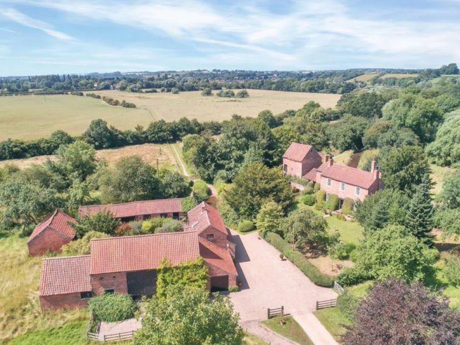 This Grade II listed period mill house contains four bedrooms, a self contained one bedroom cottage, an attached former mill, paddocks and woodland. The property is accessed via a private sweeping driveway. Guide price 1,750,000 GBP