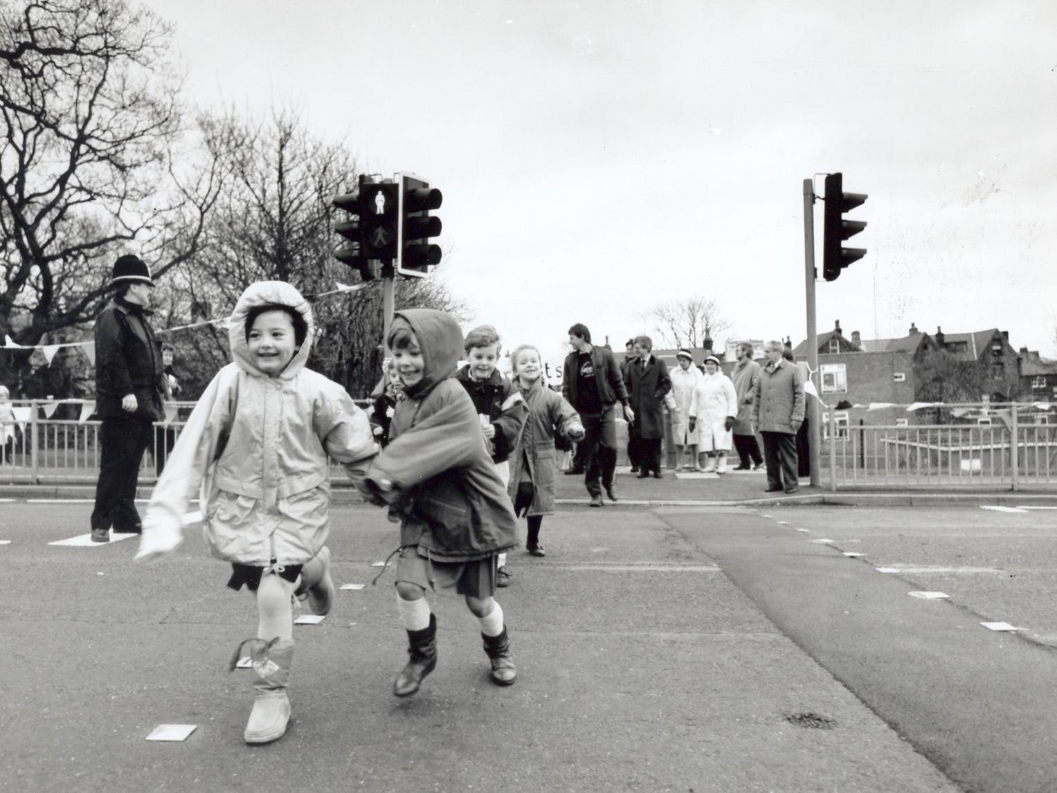 Children, parents and councillors braved a chilling wind to march across a new pelican crossing at the junction of Church Road and Church Lane - more than 20 years after a campaign was launched to get it