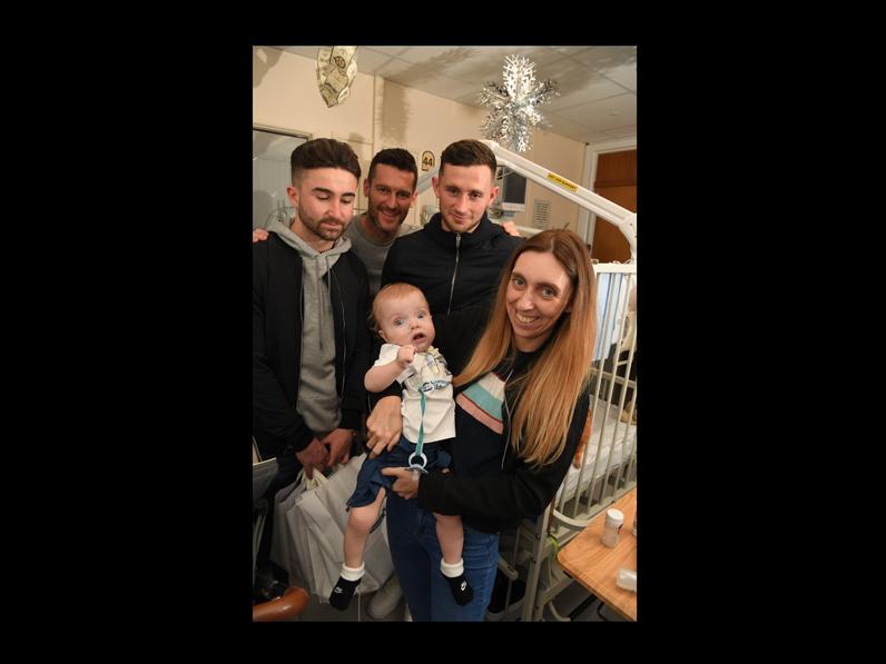 Sean Maguire, David Nugent and Alan Browne with young North Ender Hughie King