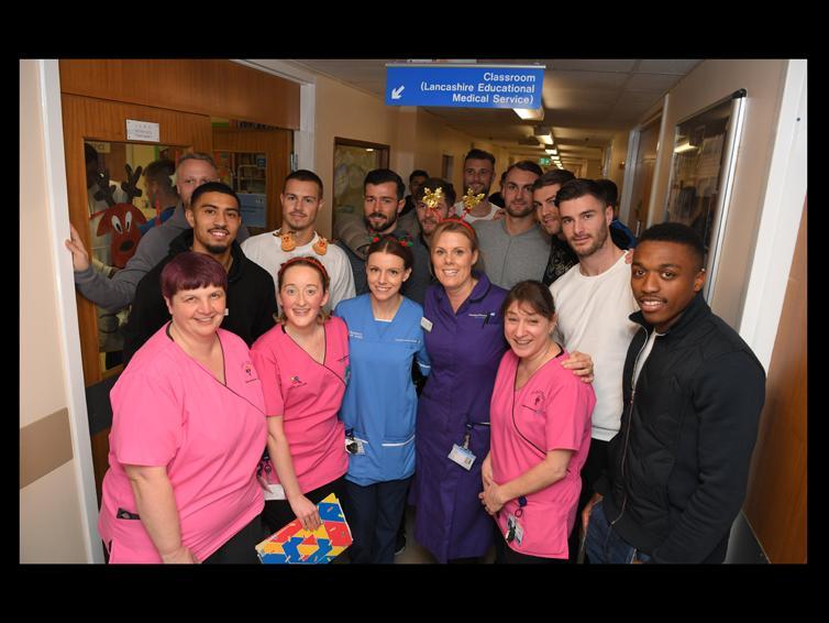 Players and staff at the hospital