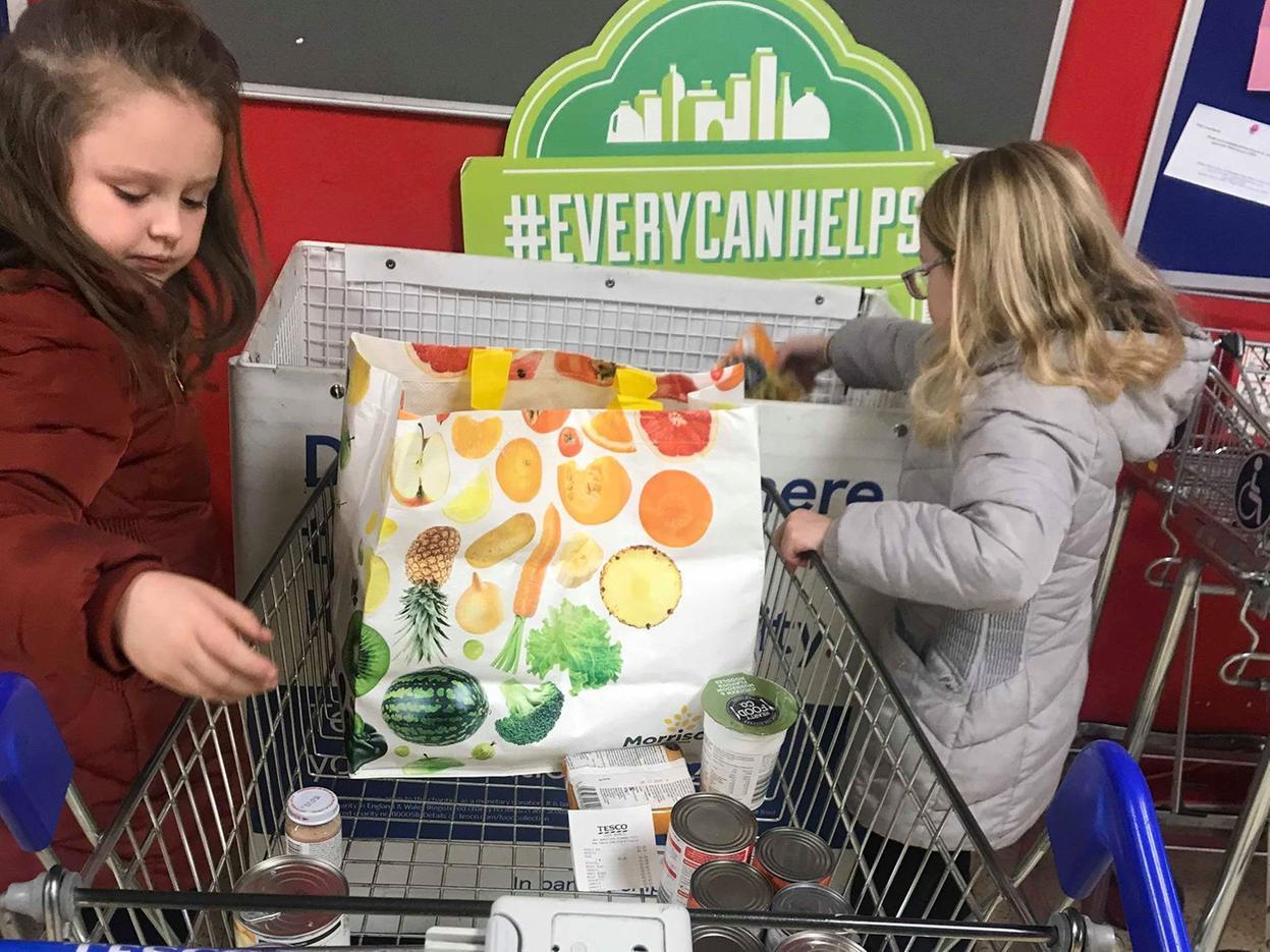 Ella and Ruby Forrester used their money they got from Elf on the Shelf this Christmas to buy cans of food for their local food bank
