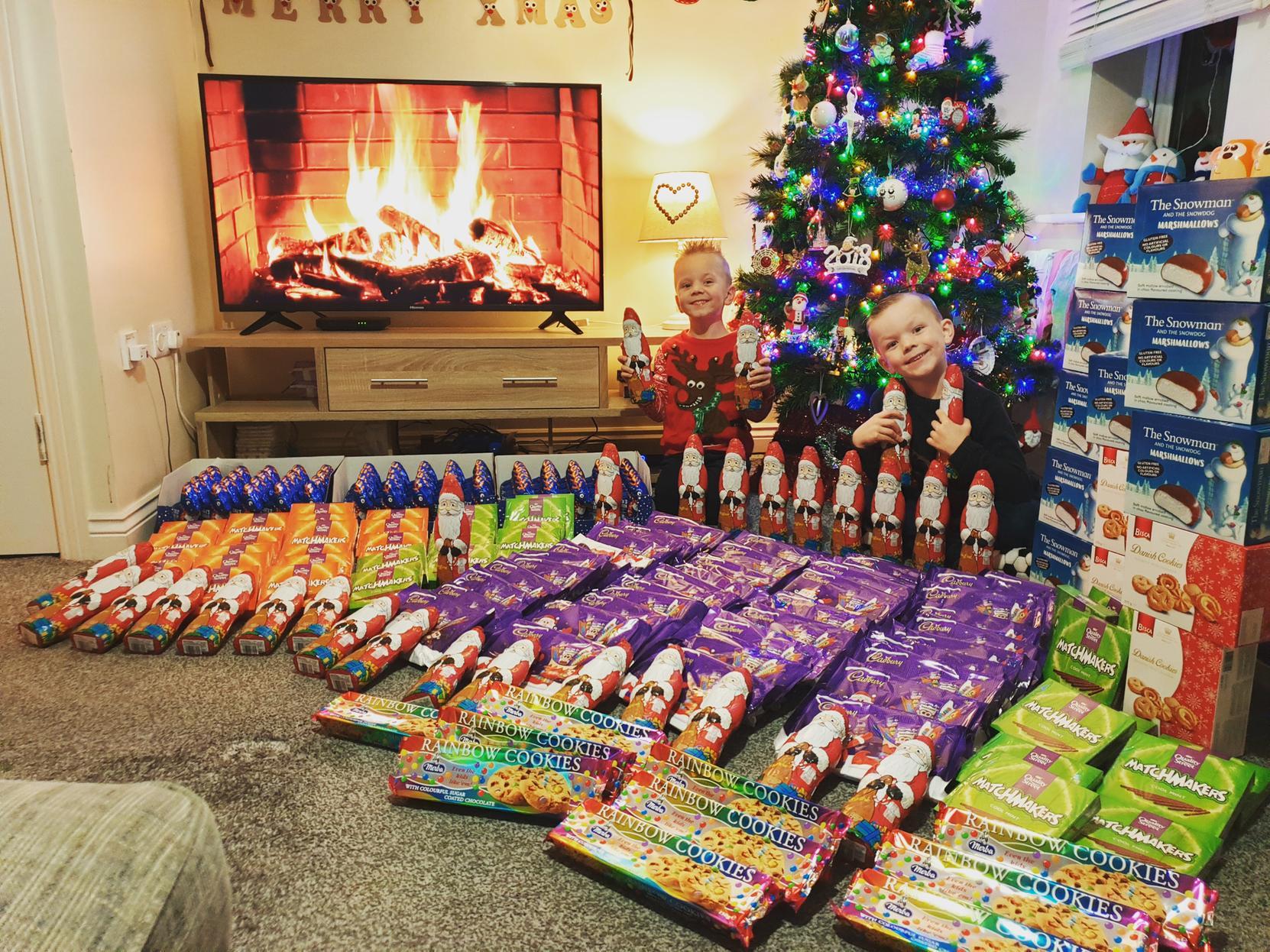 Alfie and Joey Wormald bought hundreds of selection boxes and chocolate reindeers for children in Leeds whose families will be using food banks over Christmas