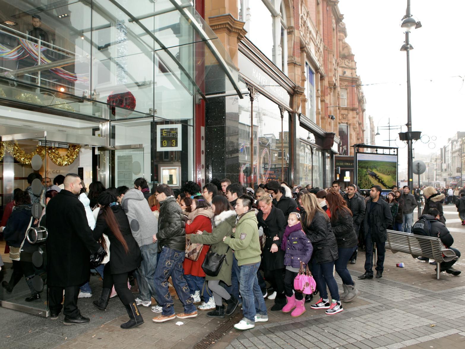 Hundreds of sales hungry shoppers rush in to Harvey Nichols as the doors open for its Boxing Day sale