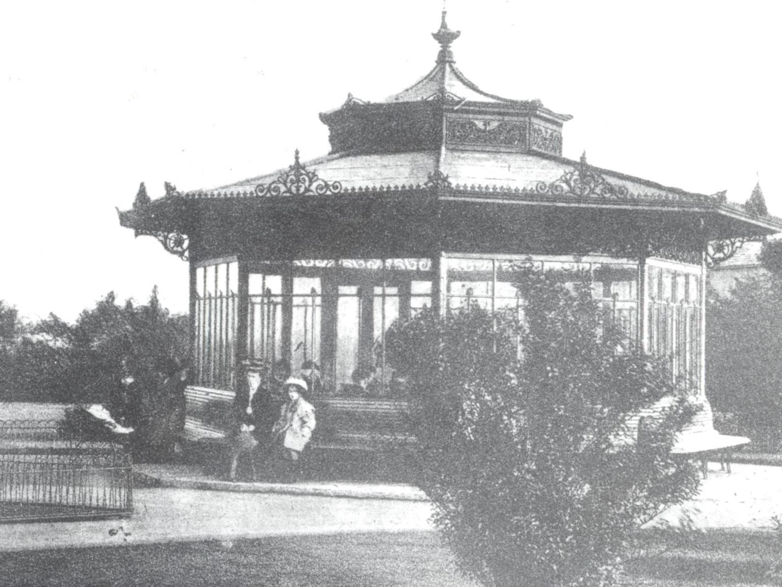 The 'old man's shelter' in Cross Flatts Park. In the background on thew left is the top of the bandstand where two brass bands played on Sunday afternoon.