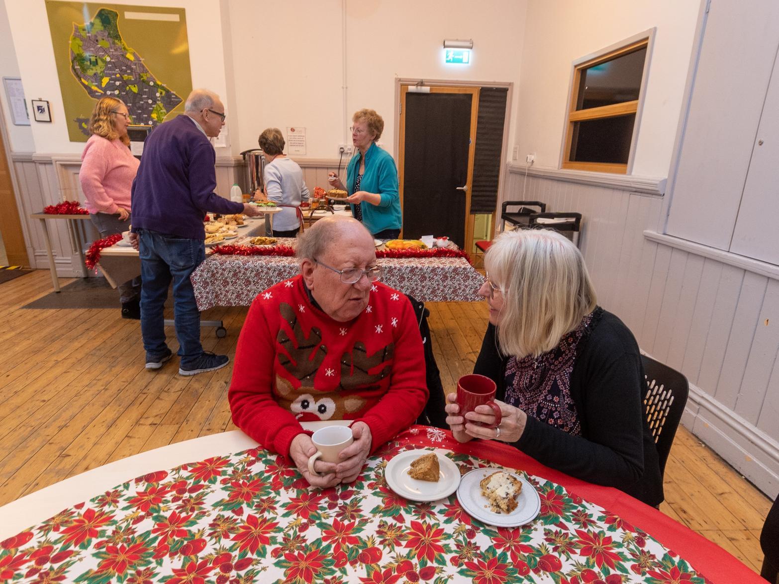 Michael Hassell, and Rosie Nadin-Pummell, who both volunteer for the be-friending service with OWLS have a chat at the HEART community cafe in Headingley.