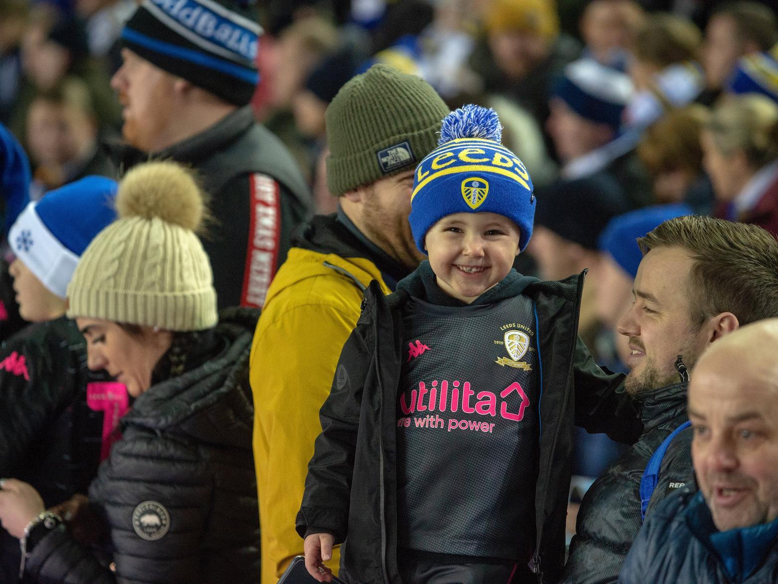 A young fan enjoys the atmosphere at Elland Road.