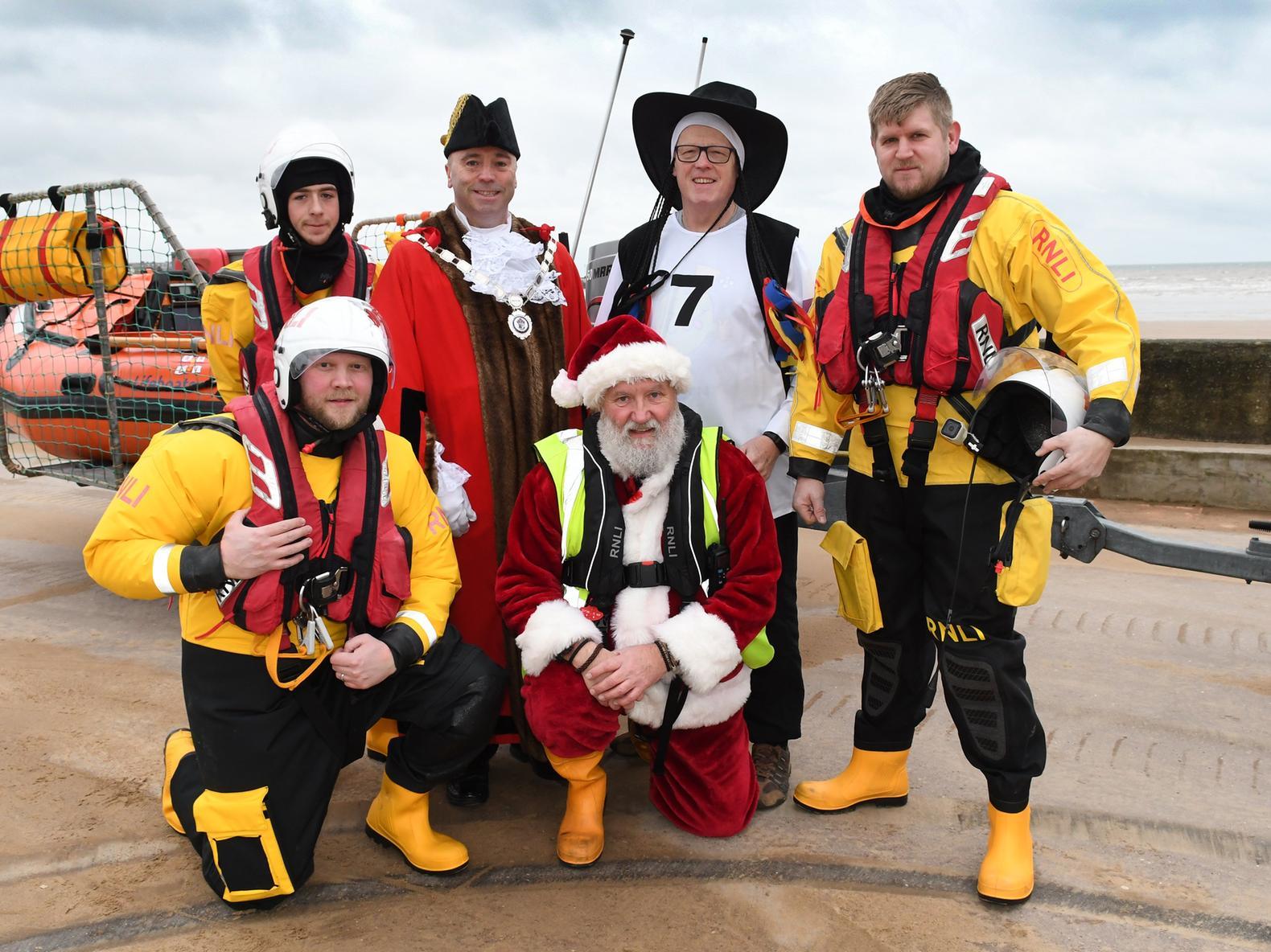 Bridlington Mayor Liam Dealtry with the organiser and the RNLI inshore lifeboat crew.