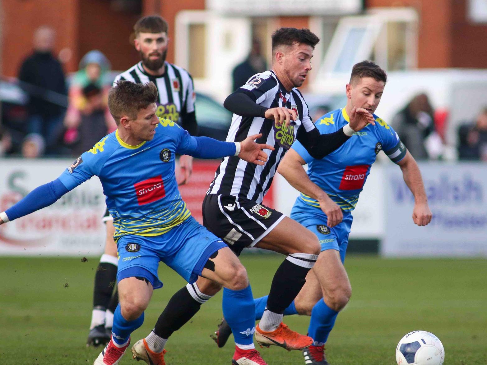Lloyd Kerry,left, and Josh Falkingham battle for possession during Harrogate Town's triumph over Chorley at Victory Park.
