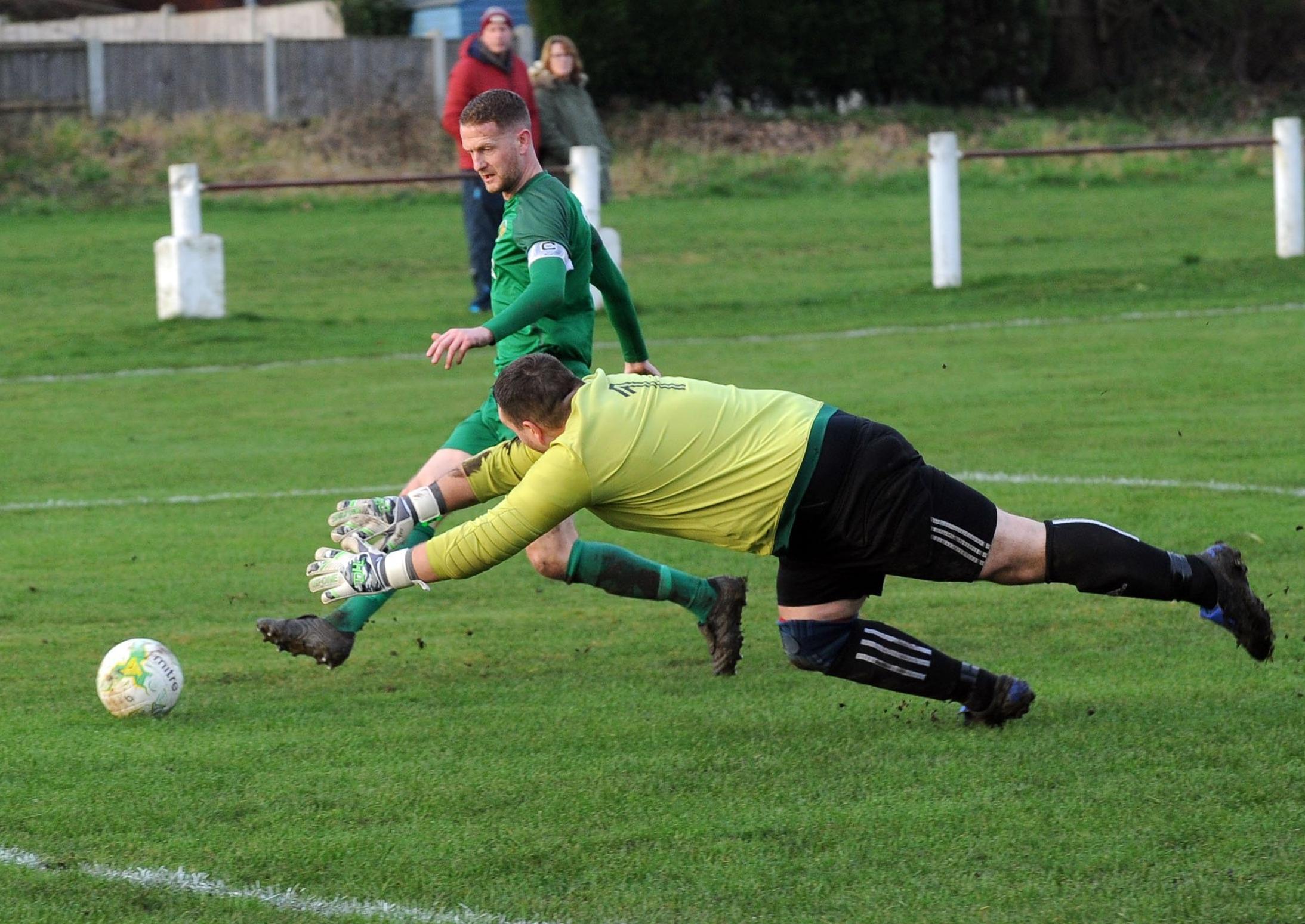 Matty Moon scores the second goal for Beeston St Anthony's  in the 2-0 win over Robin Hood.