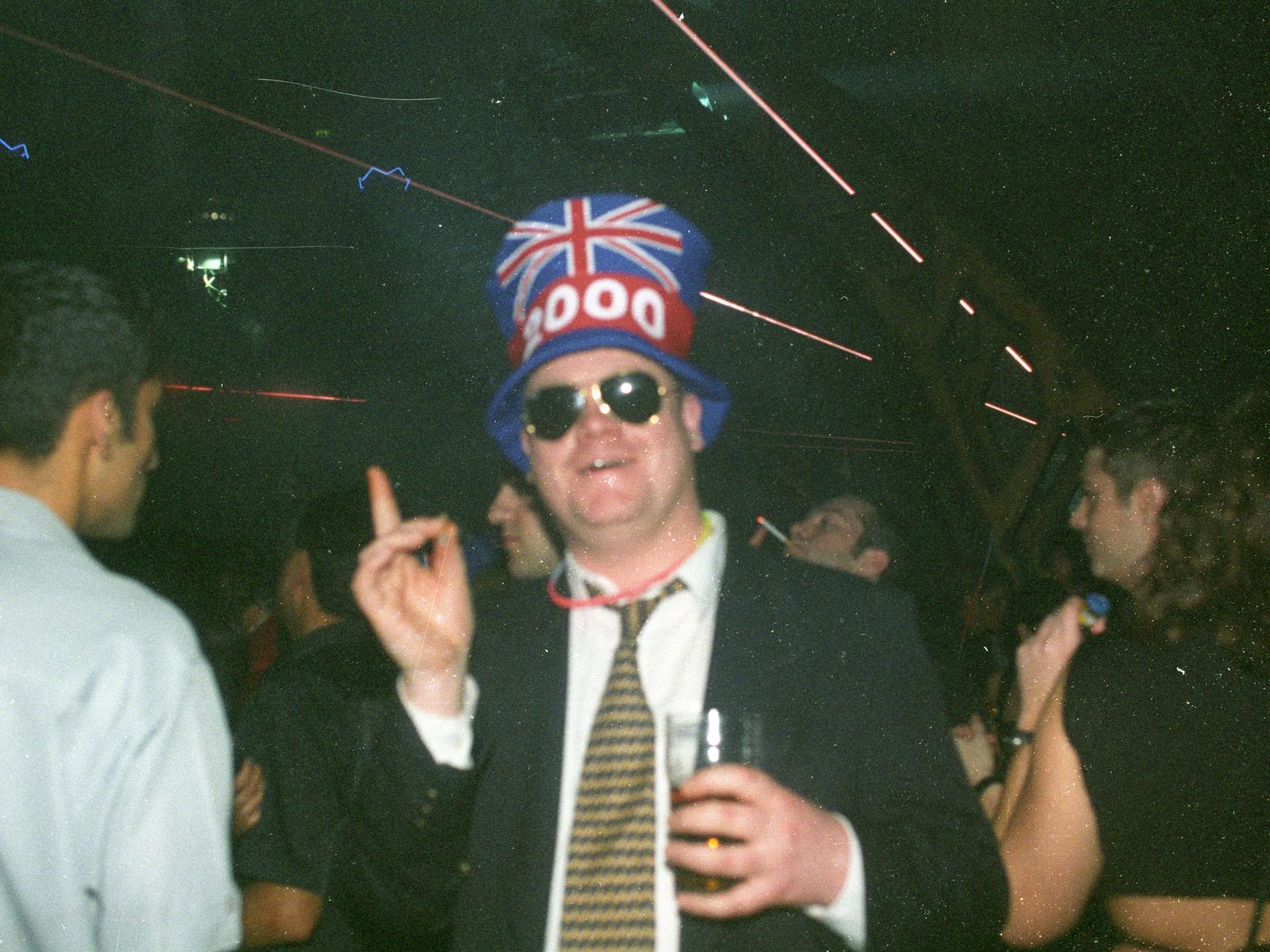 This reveller was suited up with cool shades and a hat to party, party, party.