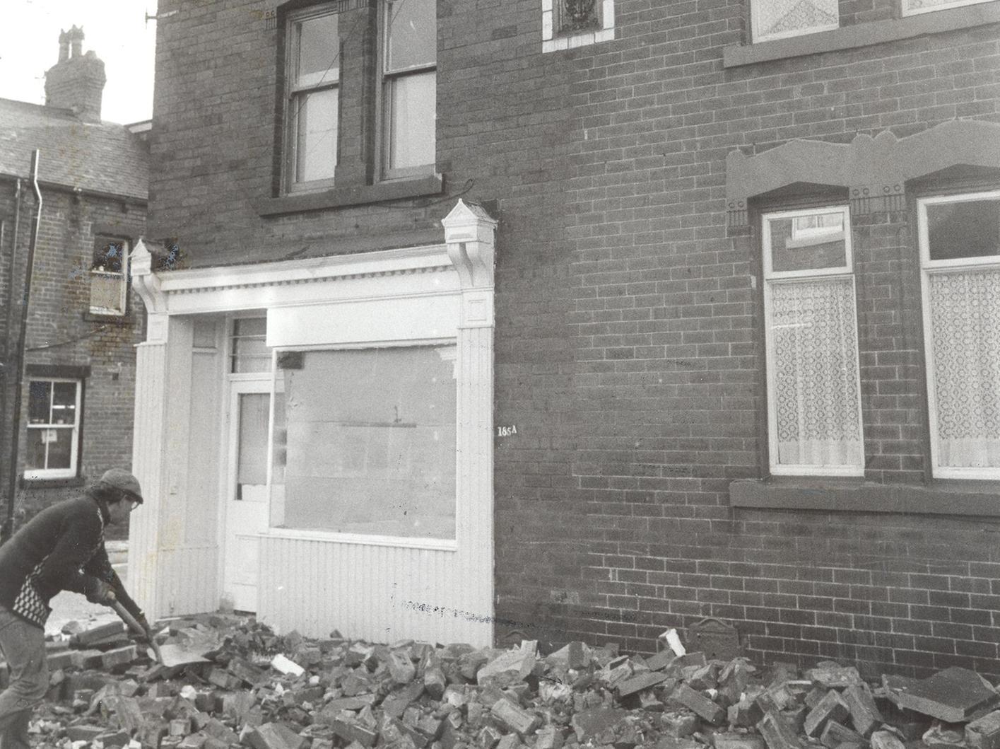 Part of Armley Town Street was cordoned off when the outer walls of two back to backs collapsed as winds approaching 100mph ripped across Leeds.