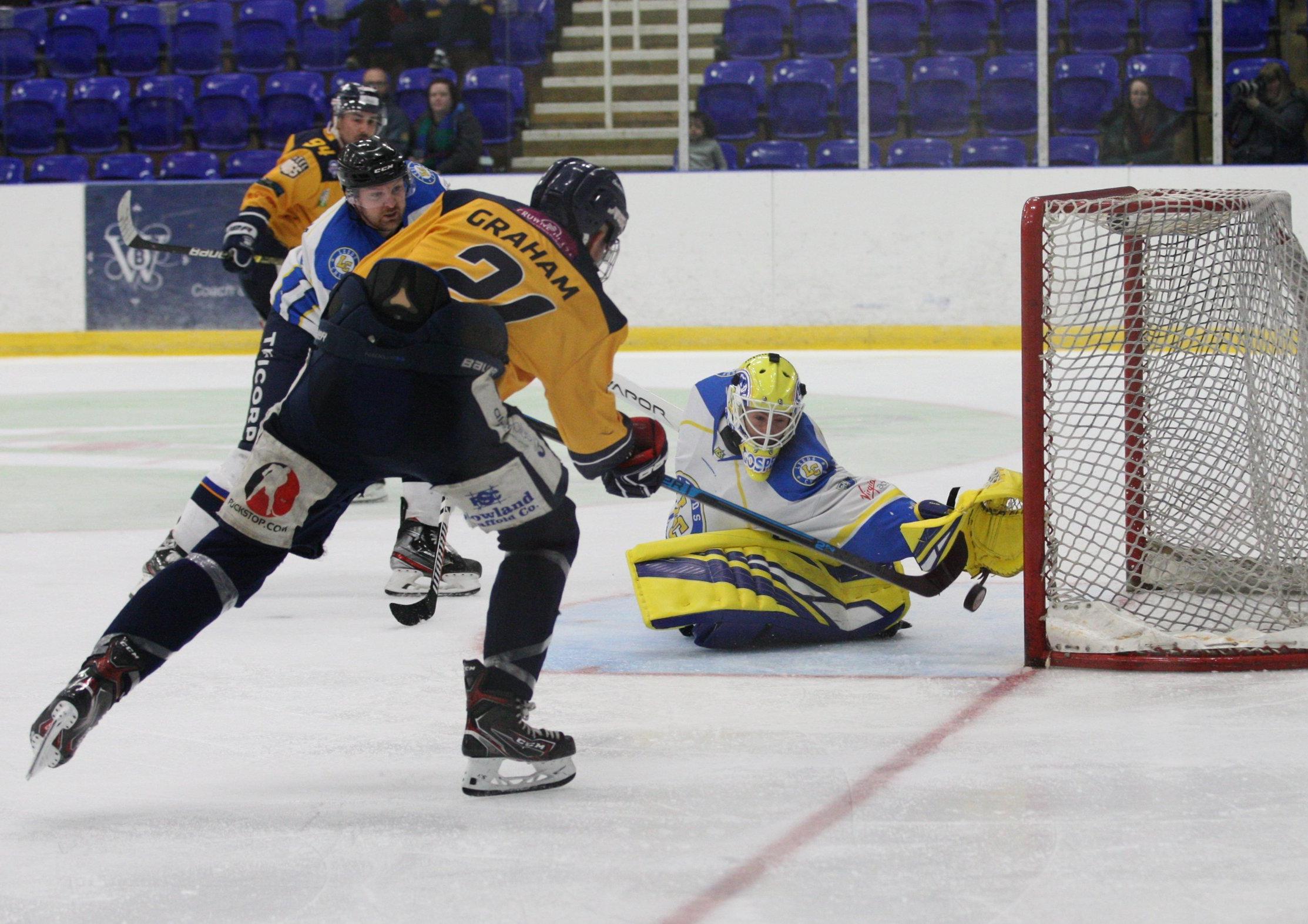 Leeds Chiefs' netminder Sam Gospel gets across to deny Alex Graham. Picture courtesy of Cerys Molloy.