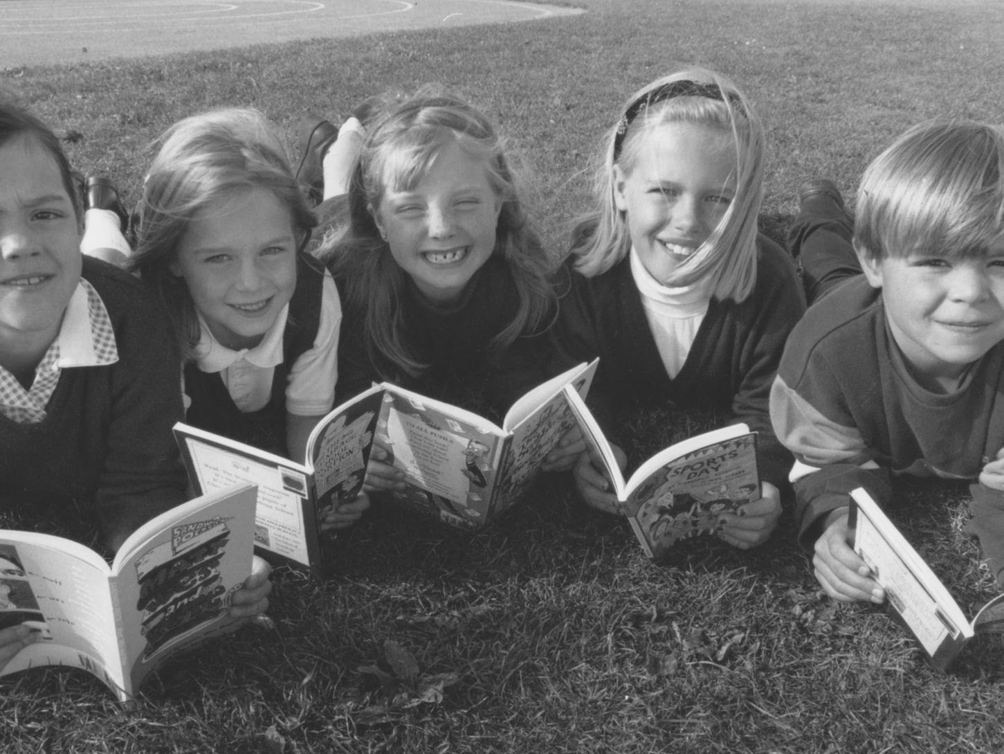 Author Wes Magee visited Hunmanby Primary School in October 1997 to hold workshops and to share his books with the children. Pictured reading some of his books are, left to right, Rebecca Milburn, Kelsey Harland, Elise Lemke, Lauren Rees and Richard Lowery.