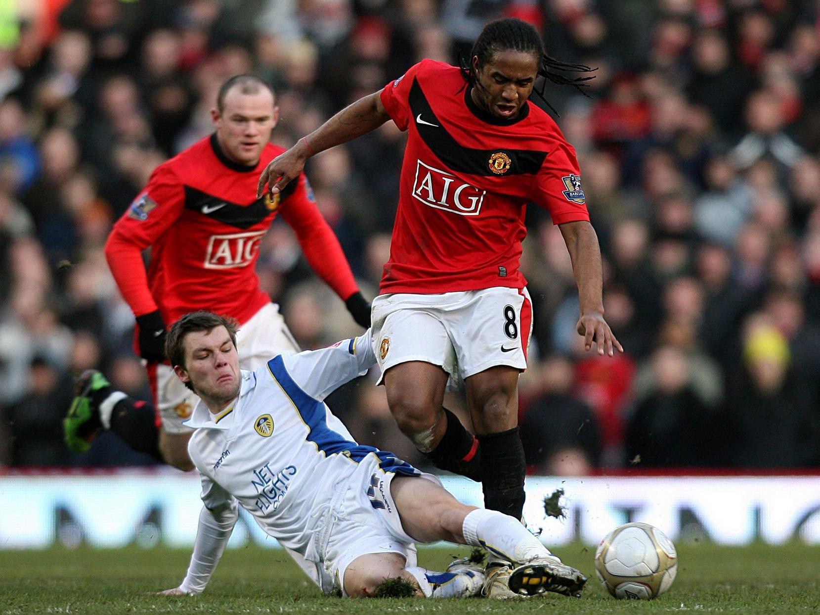 Jonny Howson tackles Manchester United's Oliveira Anderson.