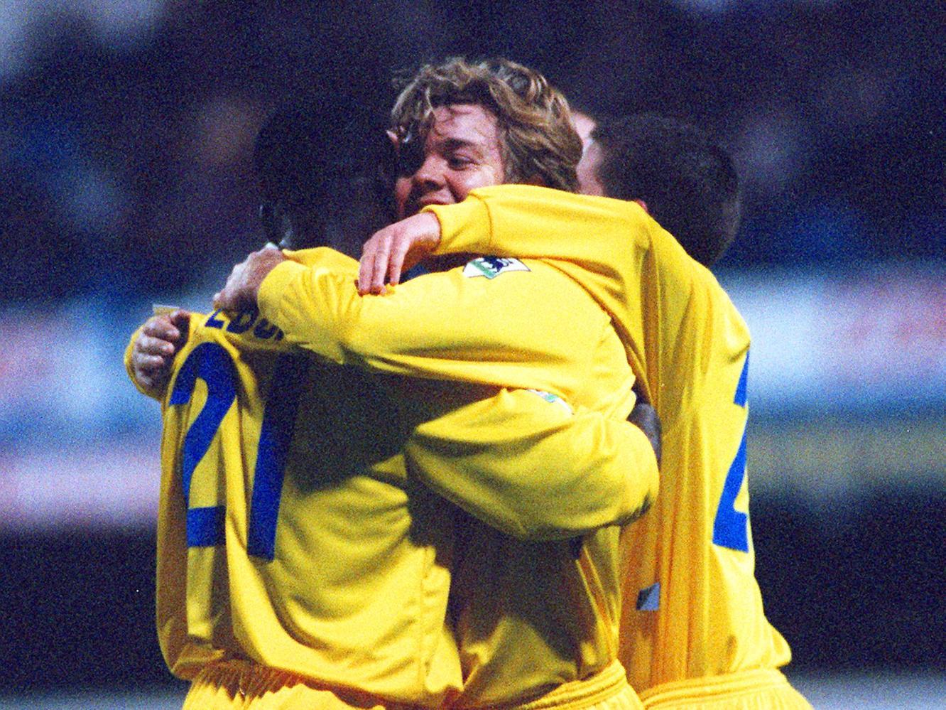 Cuddles all round as Tony Yeboah puts Leeds 2-0 up against QPR at Loftus Road in March 1996.