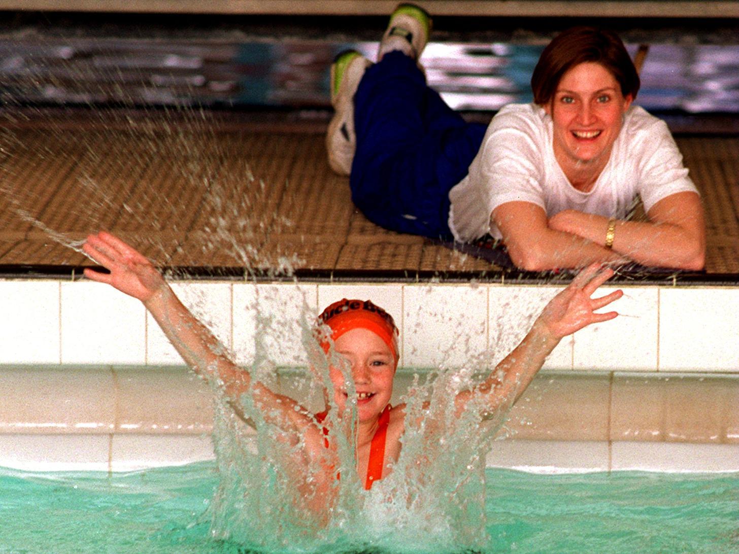 Former Olympic and Commonwealth swimmer Suki Brownsdon watches young Jonathan Plows make a splash at Morley Leisure Centre. He was one of thousands taking the plunge to raise funds to send British athletes to the Atlanta games.