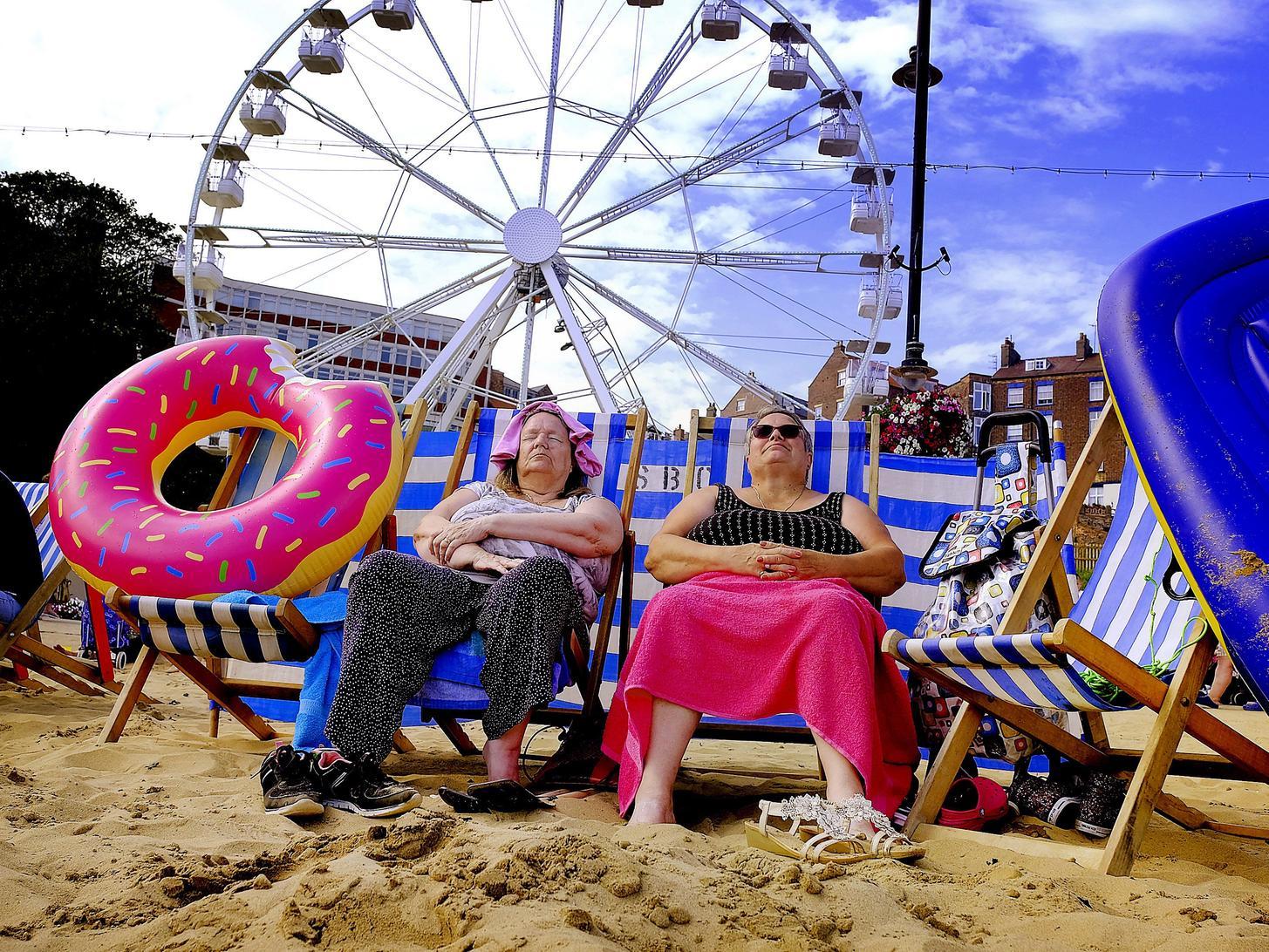 Bank holiday on Scarborough's South Bay beach, with the big wheel last year providing a different backdrop. Photo: Richard Ponter