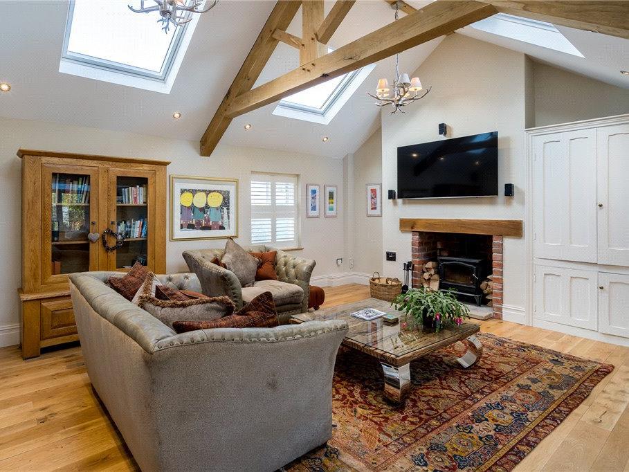 The cosy living room retains the character features while featuring modern amenities.