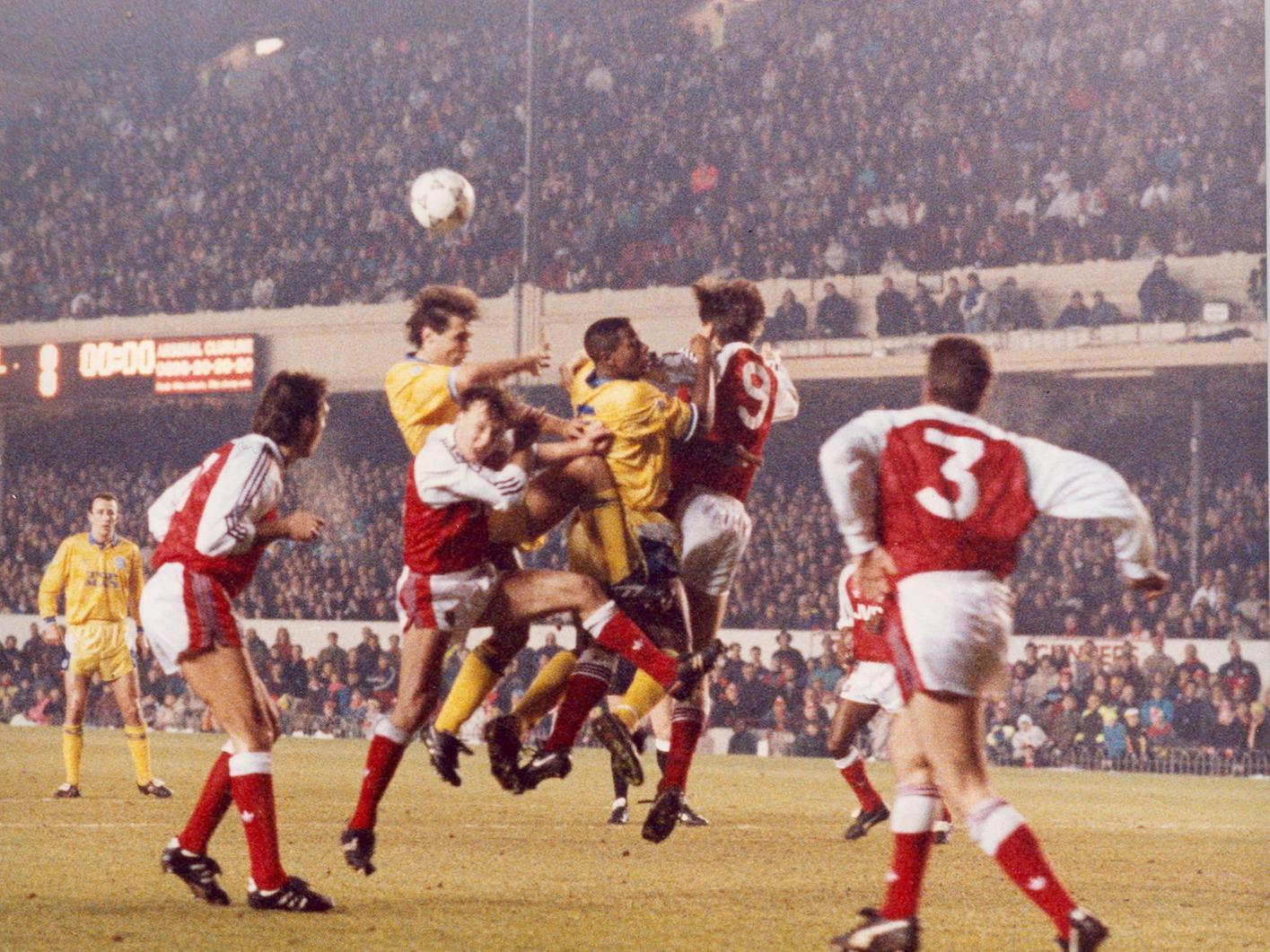 Carl Shutt spearheads an attack on the Arsenal goal during the second replay at Highbury.
