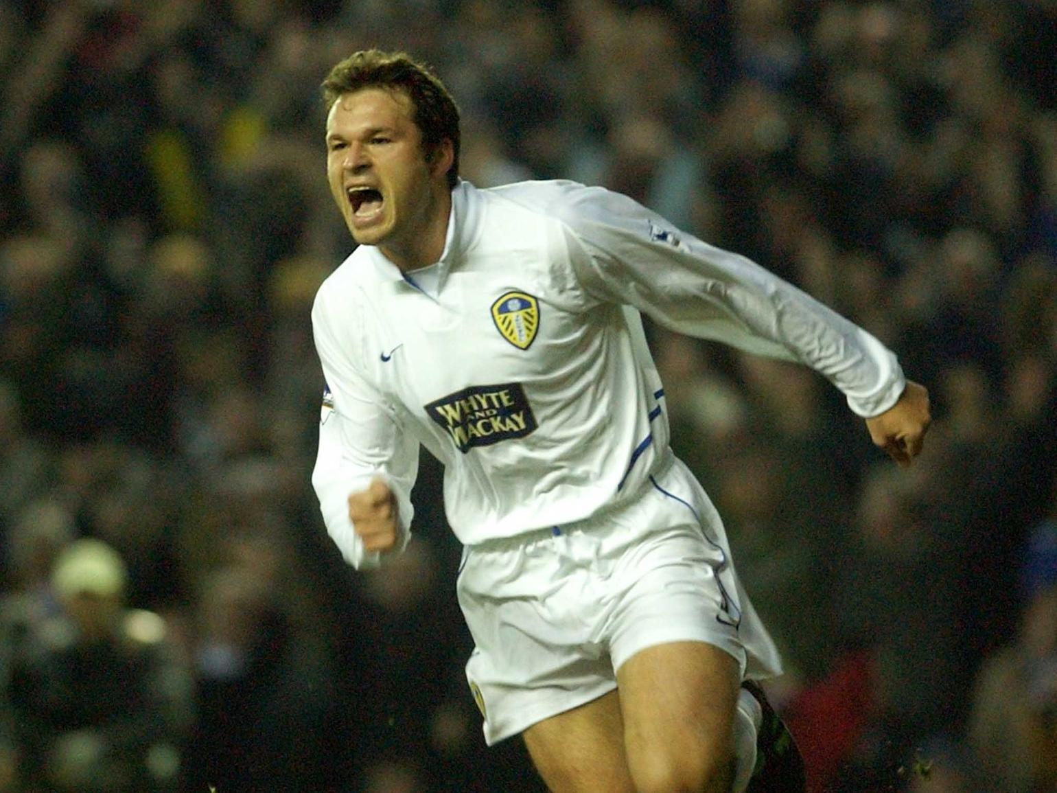Mark Viduka celebrates scoring as the Whites were outclassed by the Gunners at Elland Road.