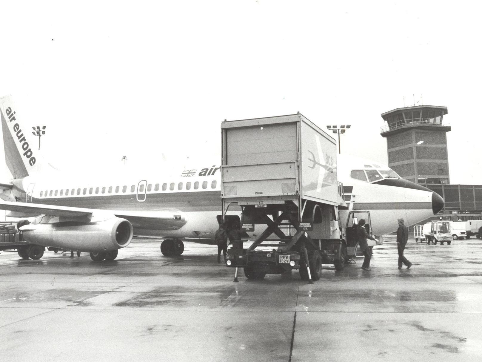 An Air Europe plane gets loaded with food and provisions.