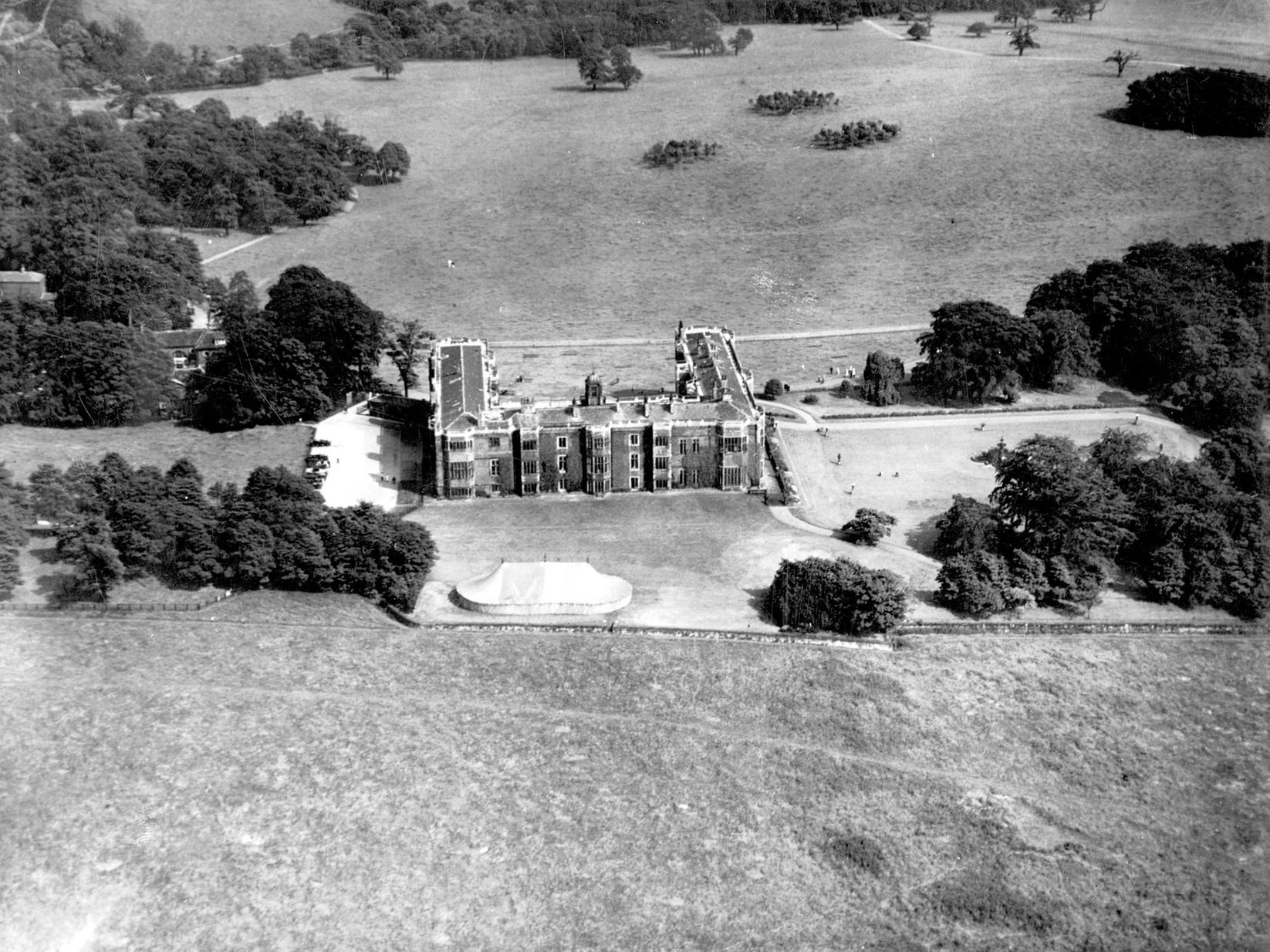 View looks from the west onto Temple Newsam House and grounds. A marquee has been set up within the grounds.