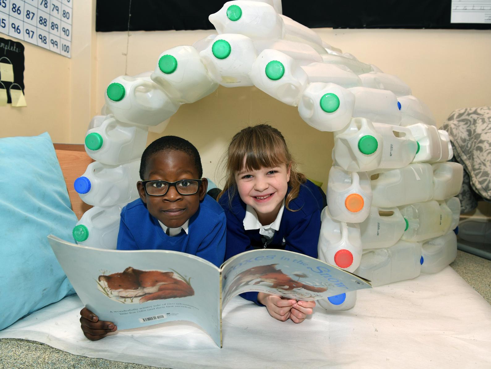 Pupils Immanuel and Lucy in an igloo that forms part of the Arctic display at Sharp Lane Primary School.
