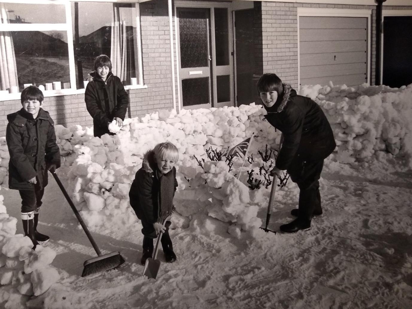 Graham and Stephen Morris with friends Jamie Quested and David Brown were putting the finishing touches to their snow castle, which they built in the garden of their home in Thornton, 1981