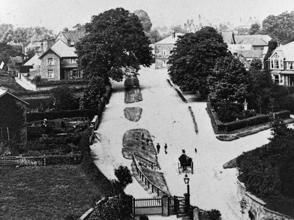 An unusual view of Scalby village taken from the clock tower of St Laurence's Church. In the middle distance through the trees is the Nags Head public house, which is still standing today, though currently waiting to reopen.