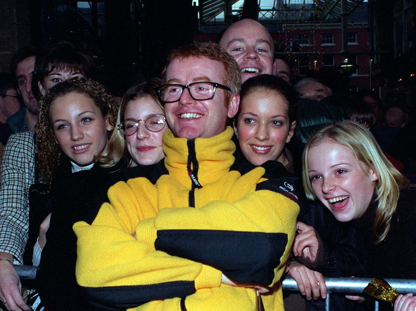 Fans crowd round the new Virgin Radio boss Chris Evans during a special charity shop sale held at Harvey Nichols in December 1997.