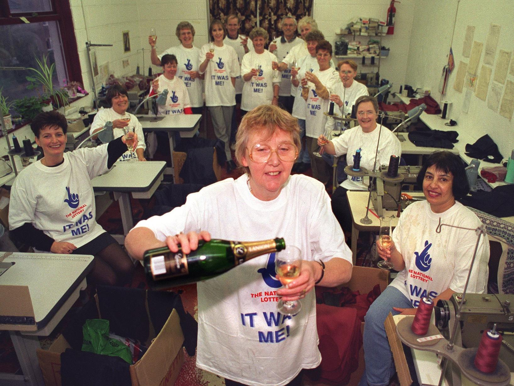 December 1997 and syndicate leader, Eileen Johnson, pours the drinks for her colleagues after M & E Johnson workers scooped more than £100,000 on The National Lottery.
