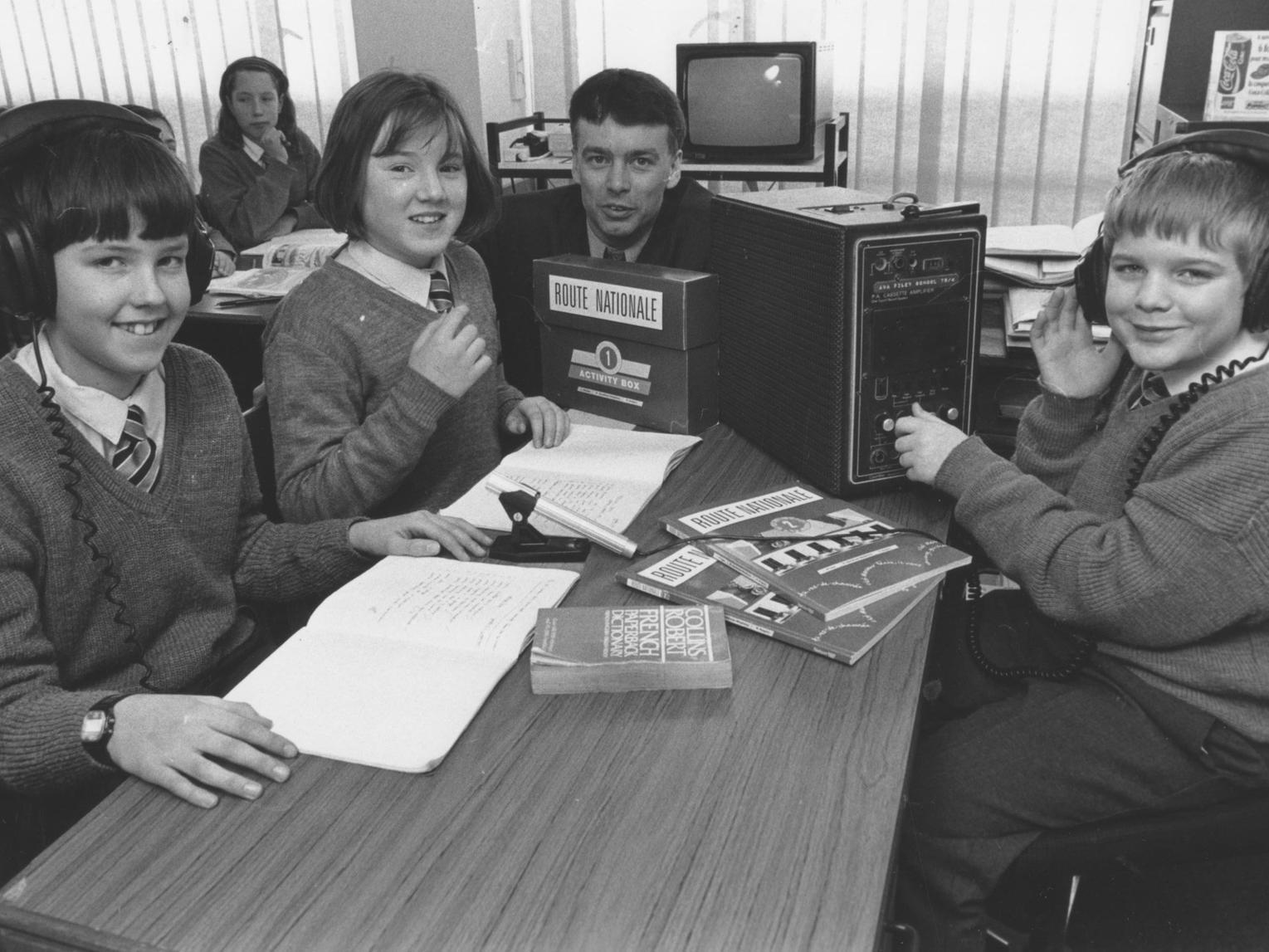 Pupils at Filey School are pictured recording samples of their French work onto tape in a mock recording session back in January 1994. Left to right are Stephen Pratt, Lora Scott, French teacher Nick Messenger, and Paul Willis.