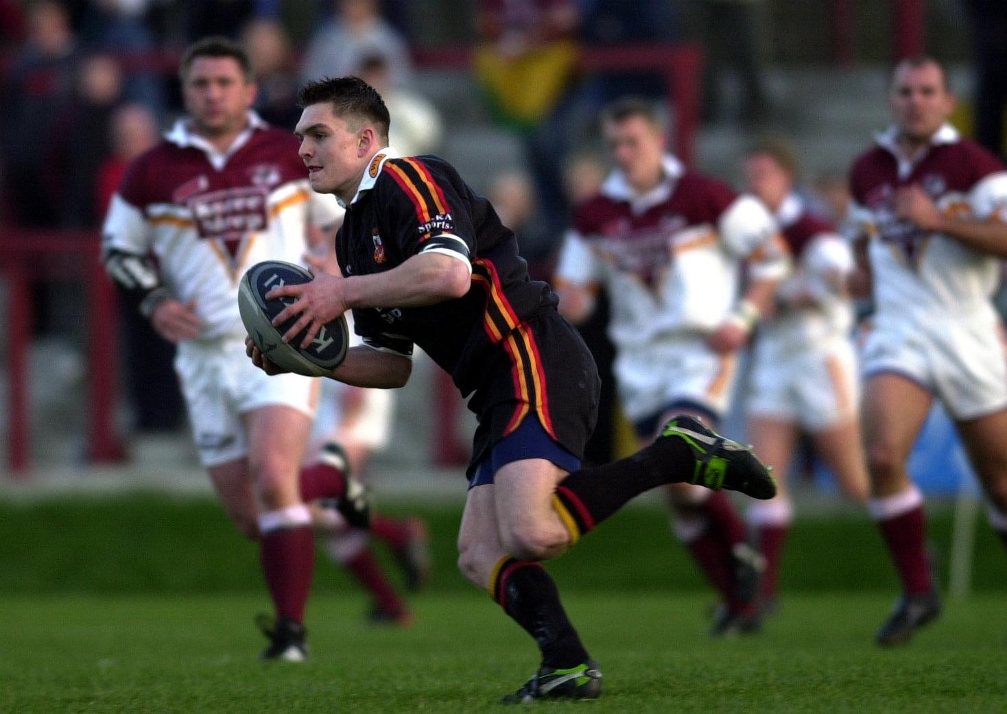 PROVING IT: Danny Brough looks up to pass on the ball while playing for Dewsbury Rams against Batley Bulldogs back in 2003.