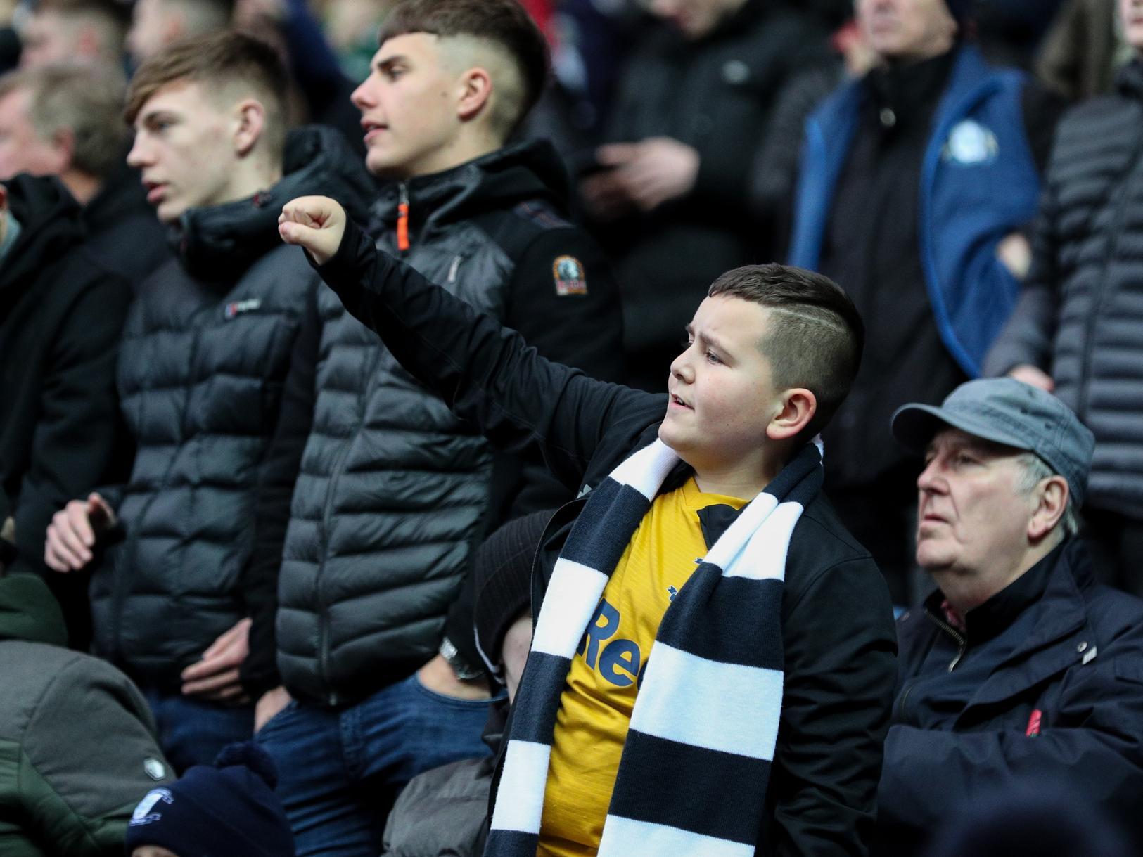 This young PNE fan sports his scarf and PNE shirt with pride