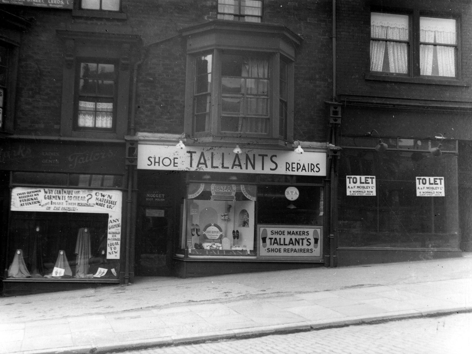 This photo shows a row of three shops on Beeston Road.
