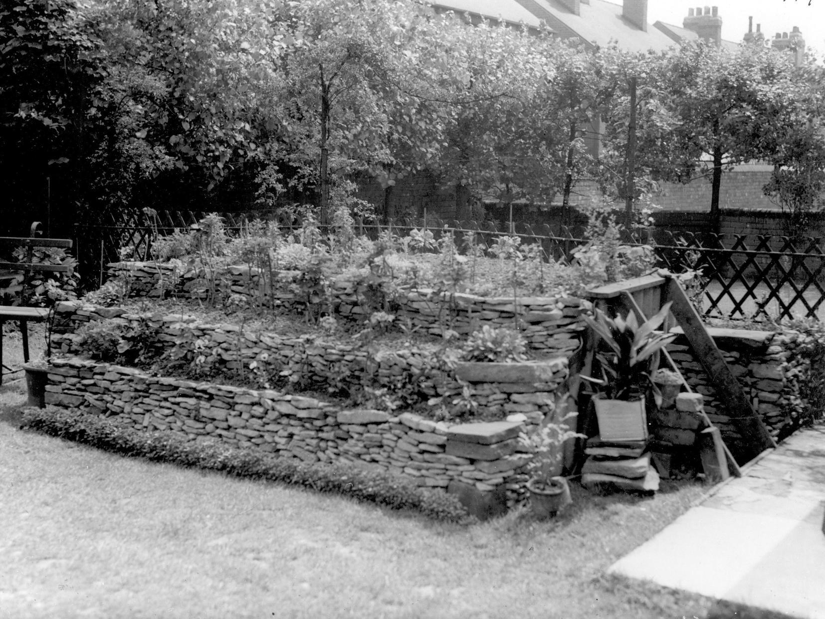 An underground air raid shelter disguised as flower beds in garden of Dalton Avenue in Beeston.