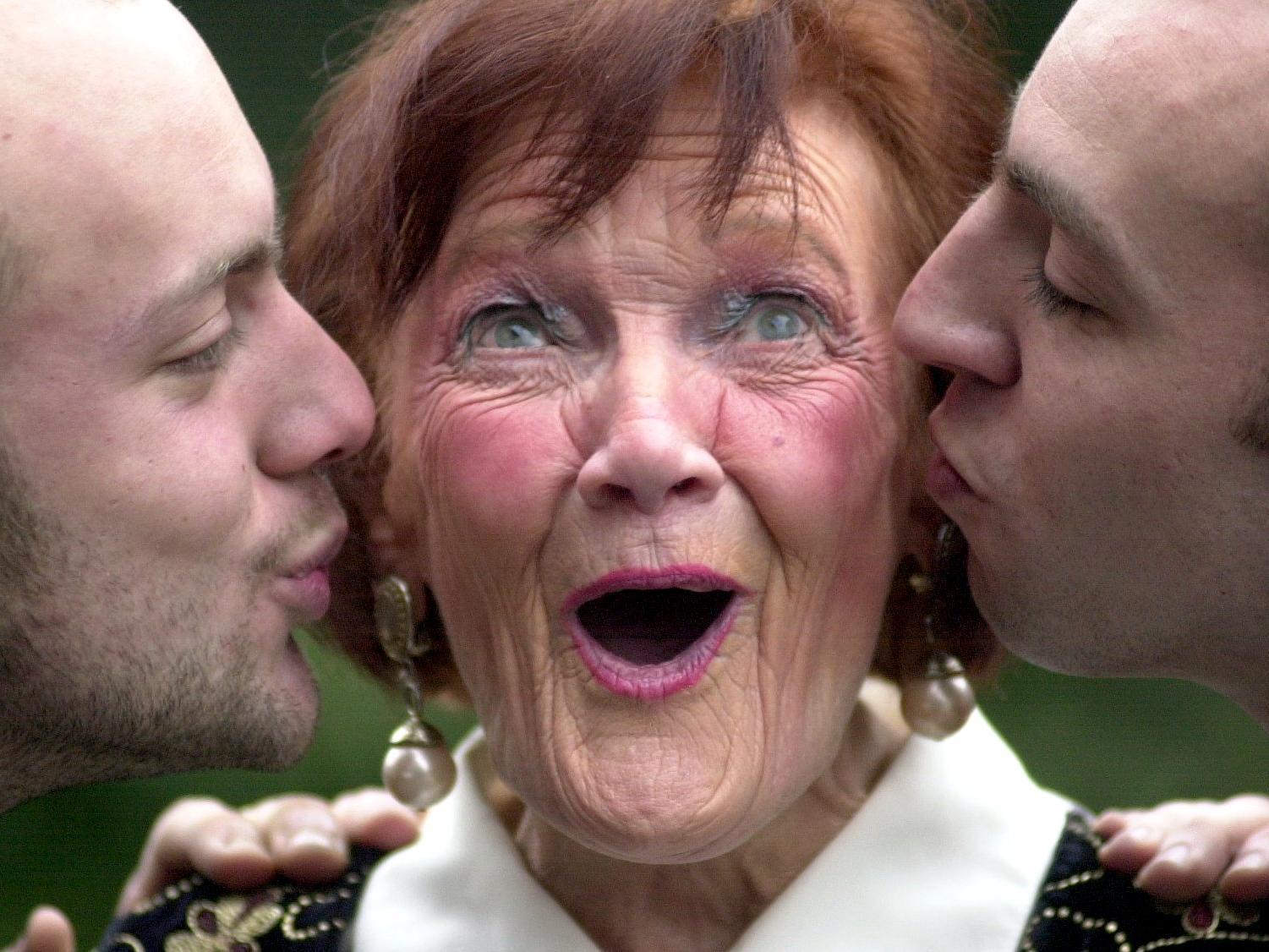 Auditions for TV's Blind Date were held the Crown Plaza on Wellington Street in January 2001. Pictured is Kathy Jones  who received a kiss from two other applicants Jai Branch (left) and Steven Schools (right).