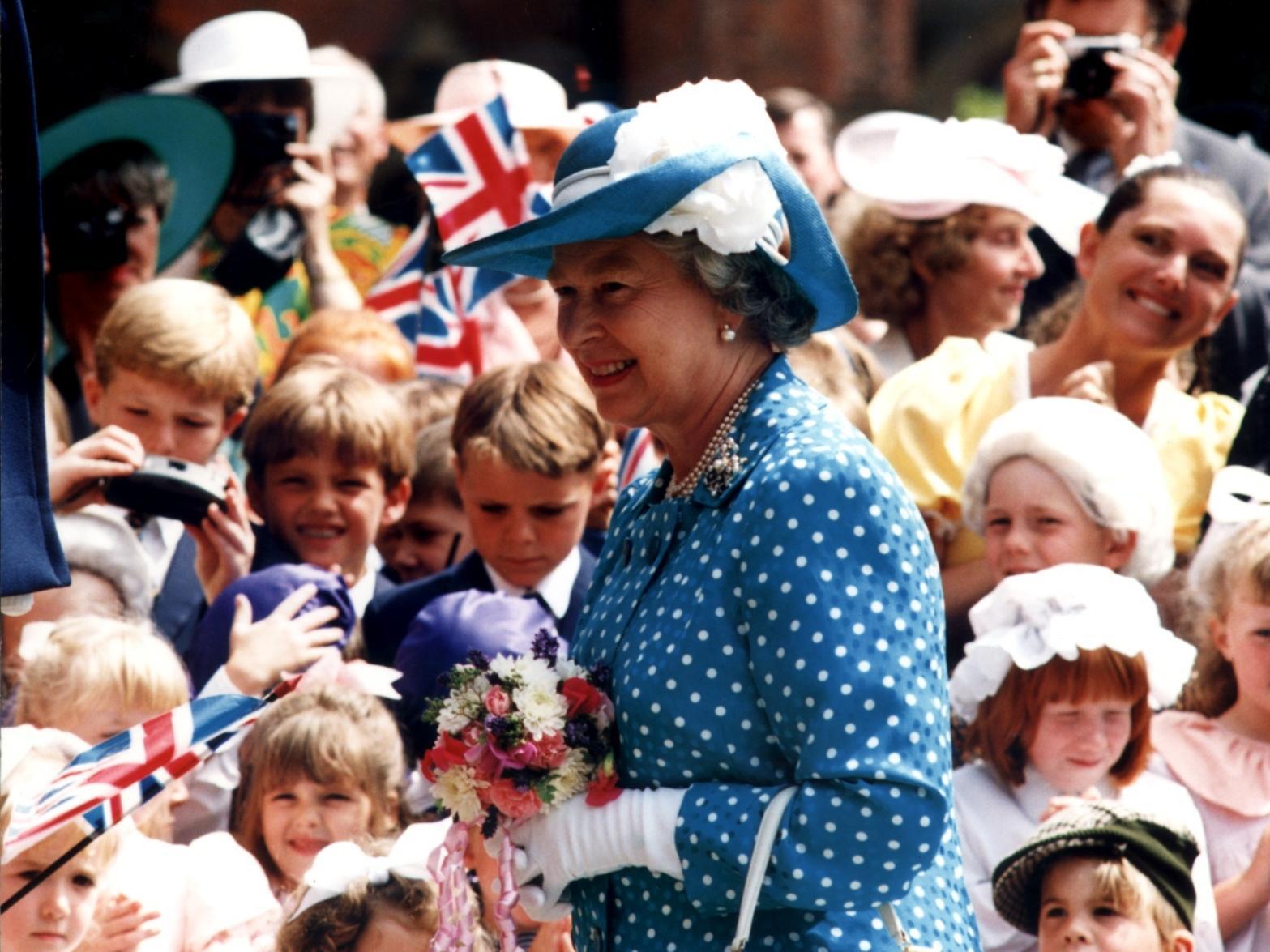 The Queen is greeted by excited children from Rossall School during her visit to Fleetwood in 1994