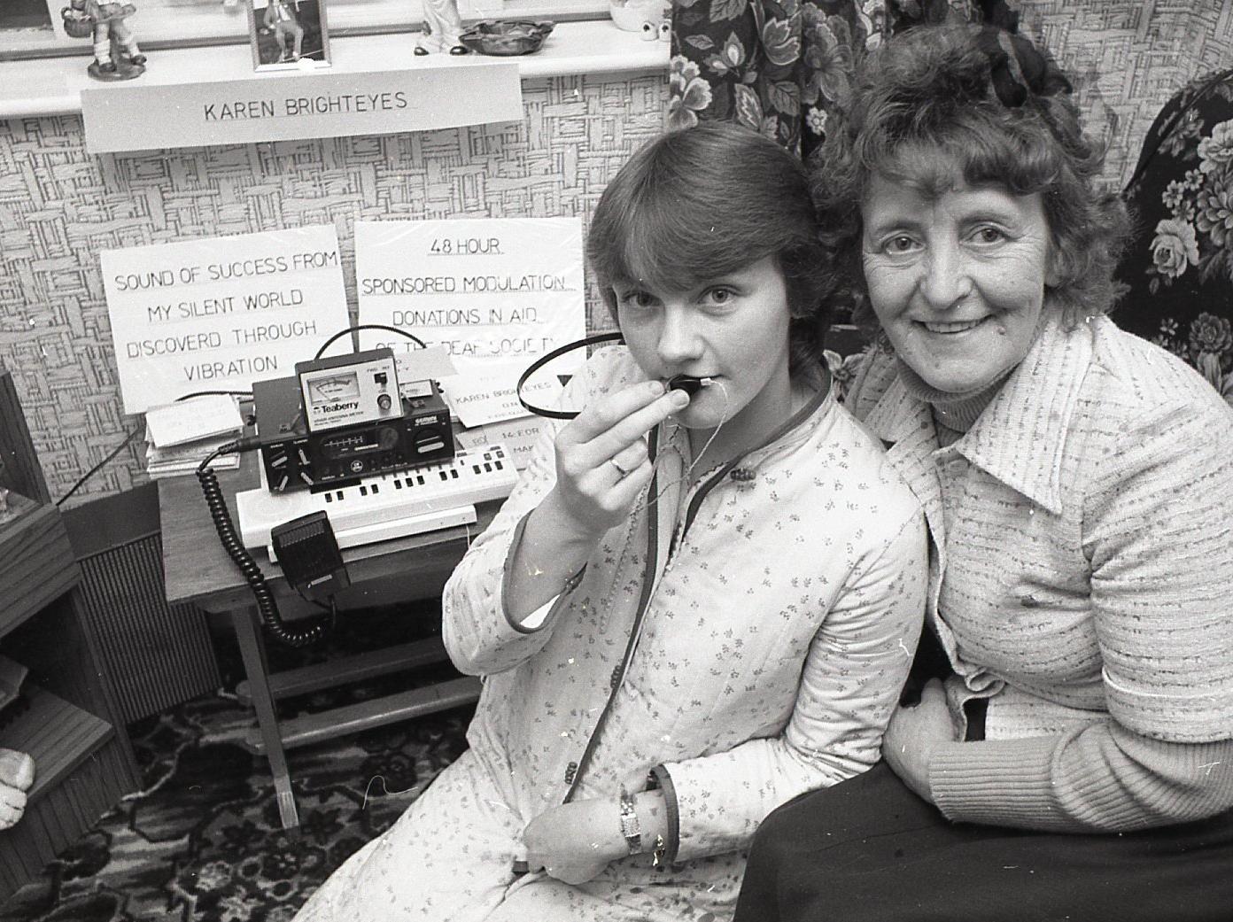 CB radio has pierced the silent world of deaf girl Karen Gardener. The 21-year-old has found a way of hearing broadcasts... with her teeth. Now she is the star "breaker" on the airwaves of seaside town Fleetwood. She is pictured above with close friend Mrs Ann Davies