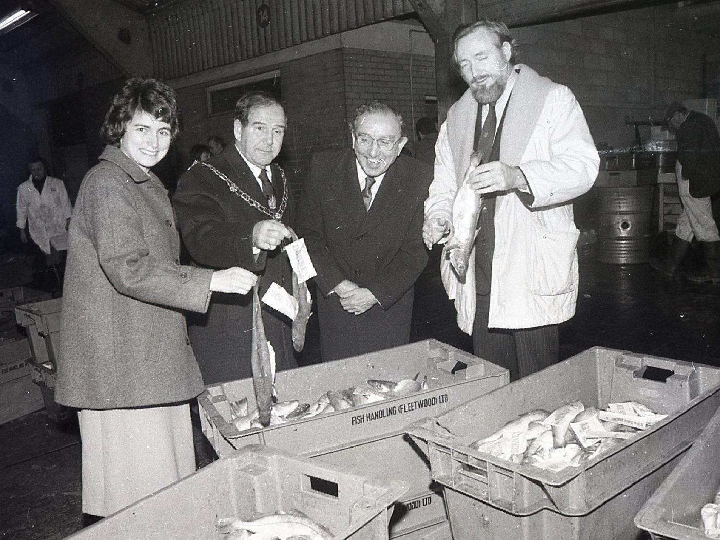 Louise Ellman, chairman of Lancashire County Council; Charles Stabbing, Mayor of Wyre; Jim Mason, chairman of Lancashire Enterprises and Owen Oyston, director of Lancashire Enterprises, inspect the first catch by a British vessel - Navena, which returned to Fleetwood dock after an absense of six months
