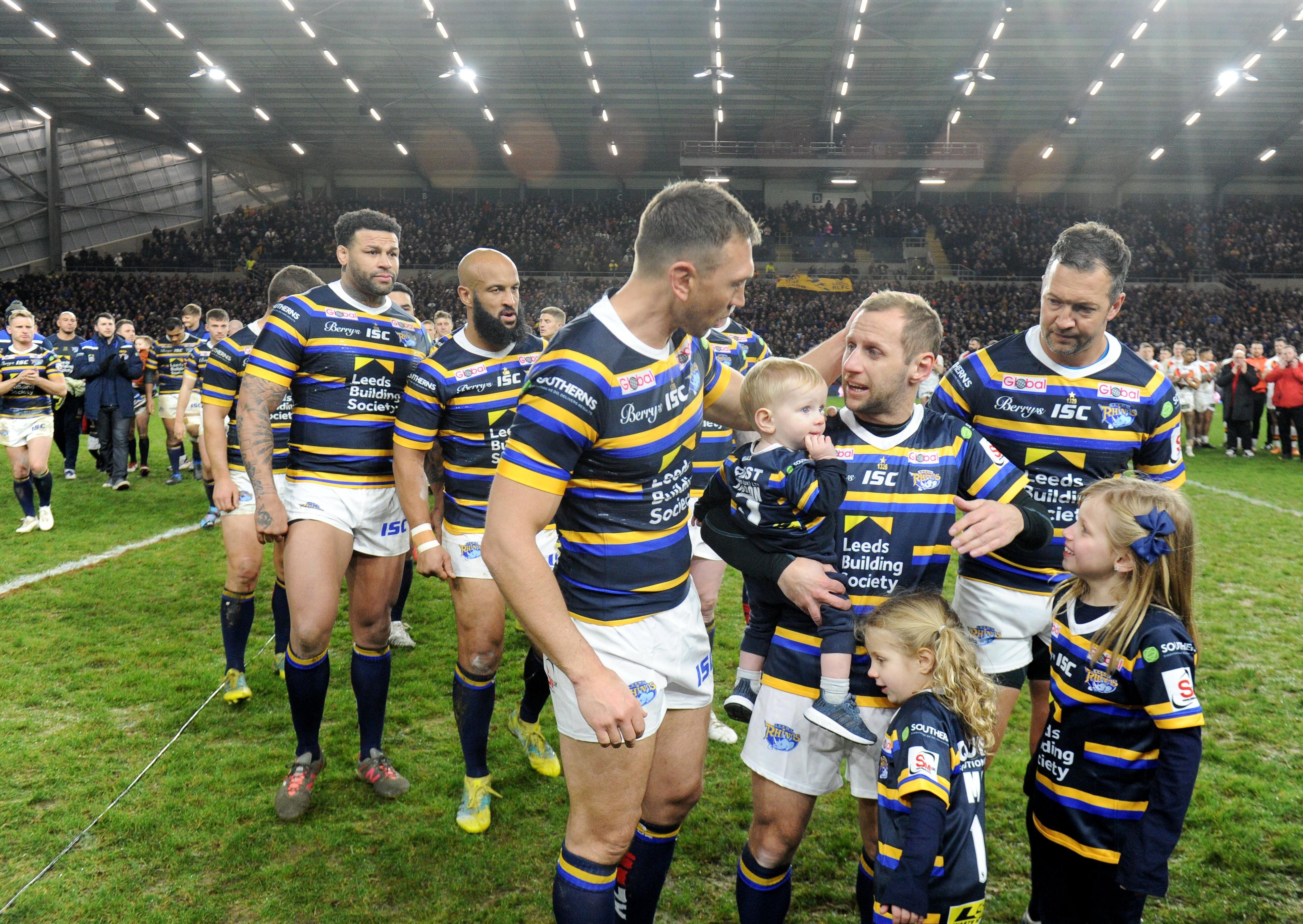 Kevin Sinfield, left, and Rob Burrow with family, team-mates and friends at last Sunday's Emerald Headingley sell-out. PIC: Steve Riding