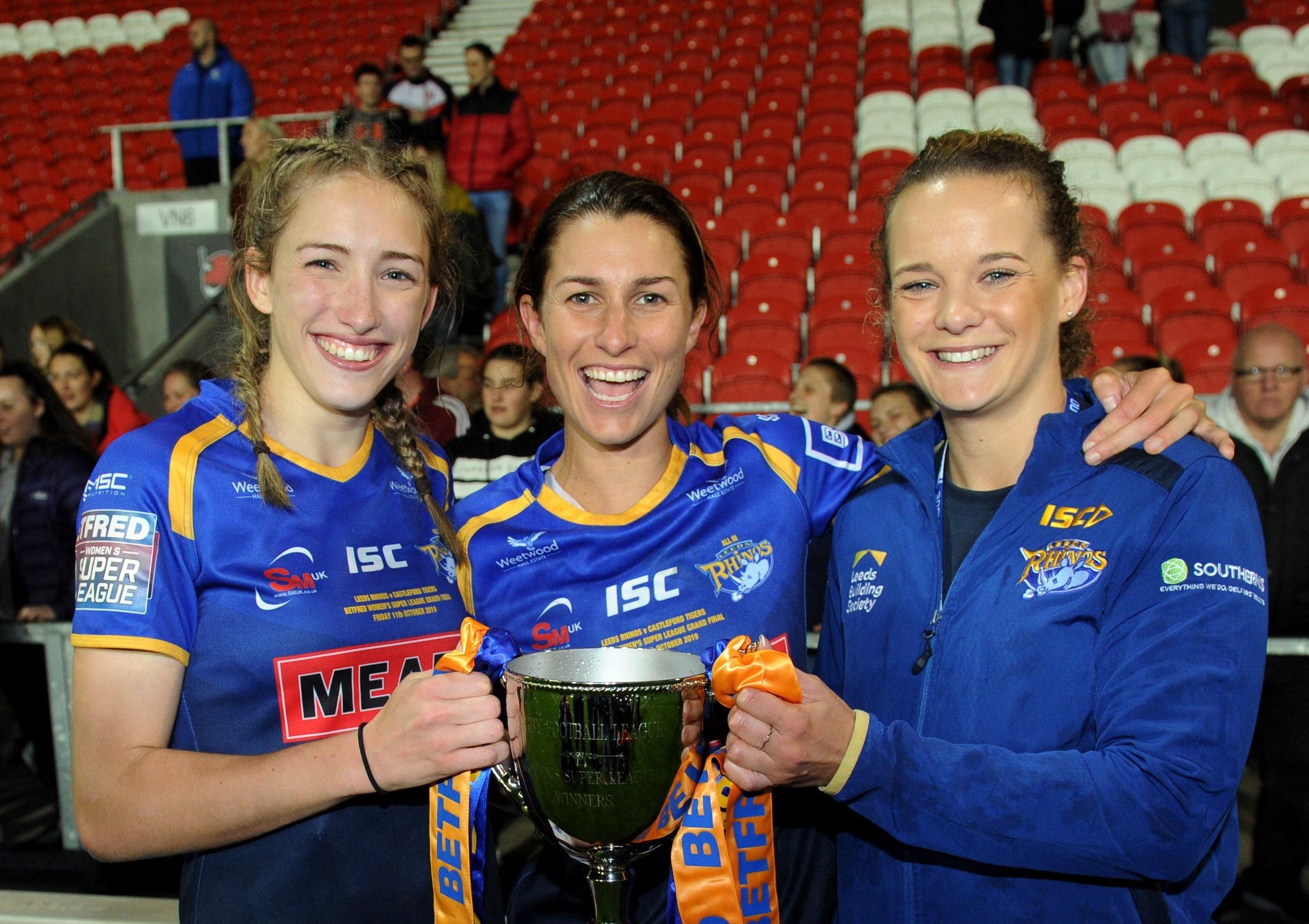 Caitlin Beevers, Courtney Hill, captain and club captain Lois Forsell, celebrate winning the Betfred Womens Super League Grand Final last year.