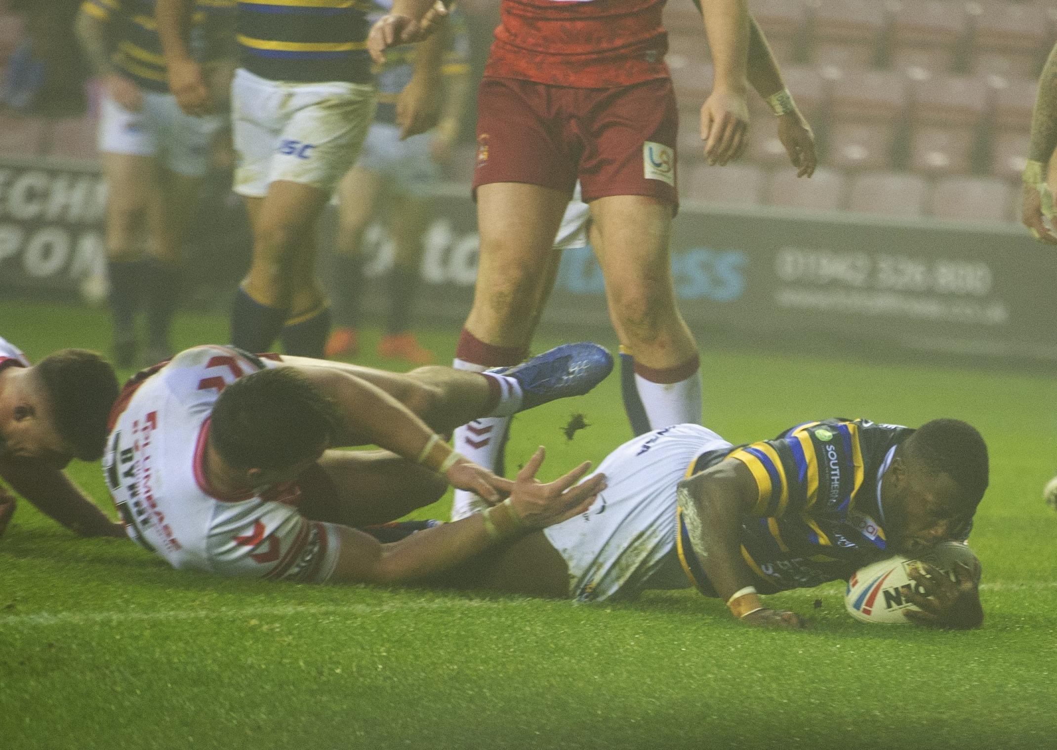 Muizz Muystapha touches down for Rhinos at Wigan. PIC: Tony Johnson/JPIMedia