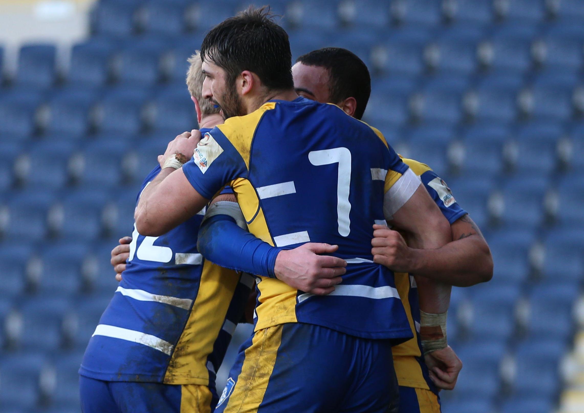 Alex Humfrey is congratulated after scoring a try for Carnegie.
