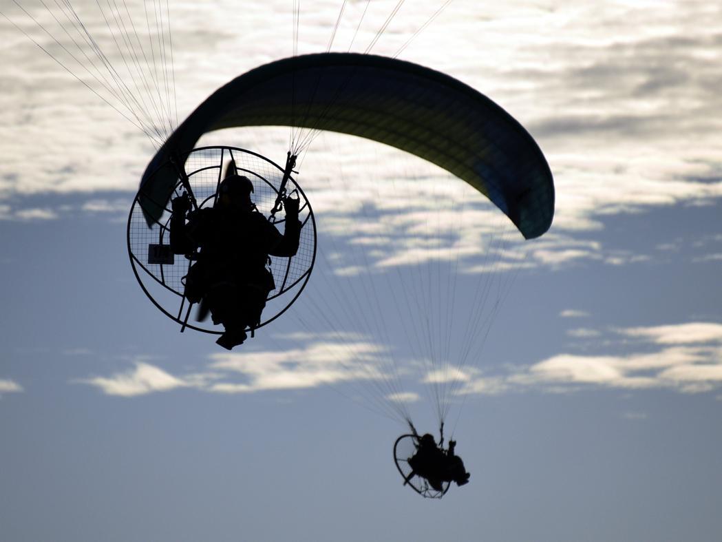 It is identical to Paragliding except it is powered so the use of an elevation or thermals to ascend are not required