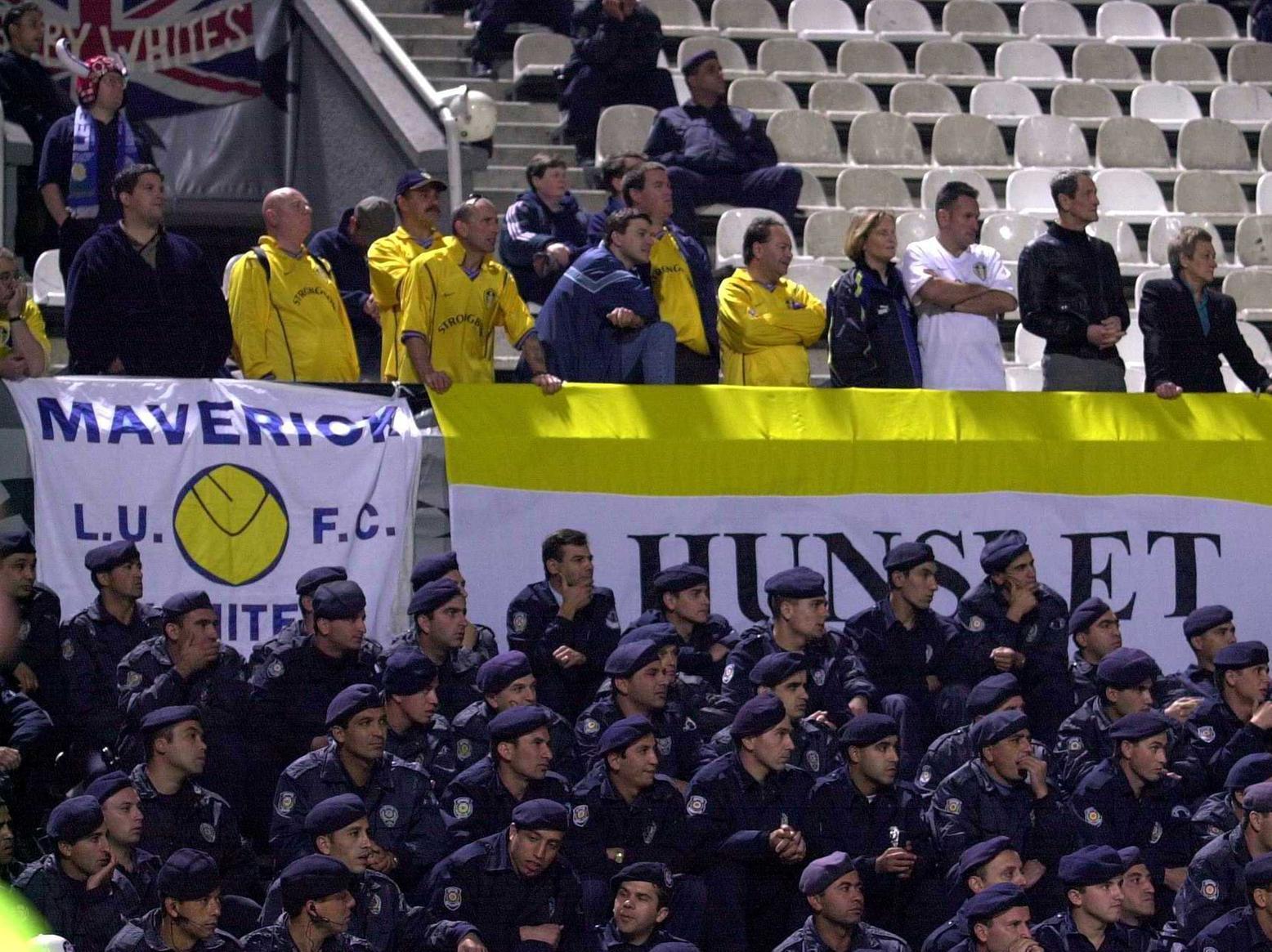 Leeds United fans under a heavy police cordon during the game at the Inonu Stadium in Istanbul.